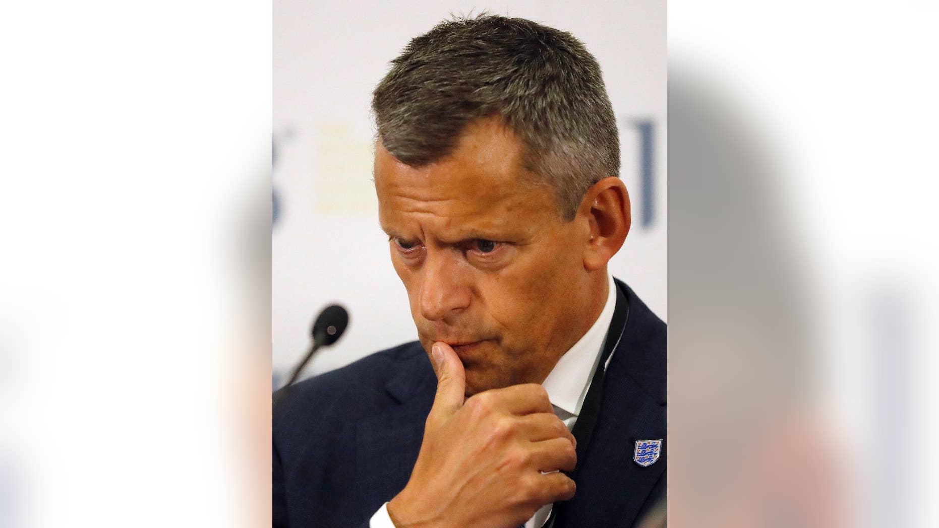 Football Association , FA, CEO Martin Glenn pauses during a press conference after the 131st International Football Association Board (IFAB) annual general meeting at Wembley stadium in London, Friday, March 3, 2017. Sin bins and rolling substitutions will be allowed in the lower levels of soccer after being approved by the game's lawmaking body. ( AP Photo/Frank Augstein)