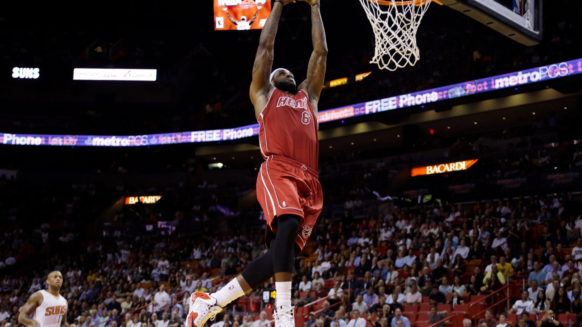 Miami Heat's LeBron James (6) shoots during the first half of an NBA basketball game against the Phoenix Suns, Monday, Nov. 25, 2013, in Miami. (AP Photo/Lynne Sladky)