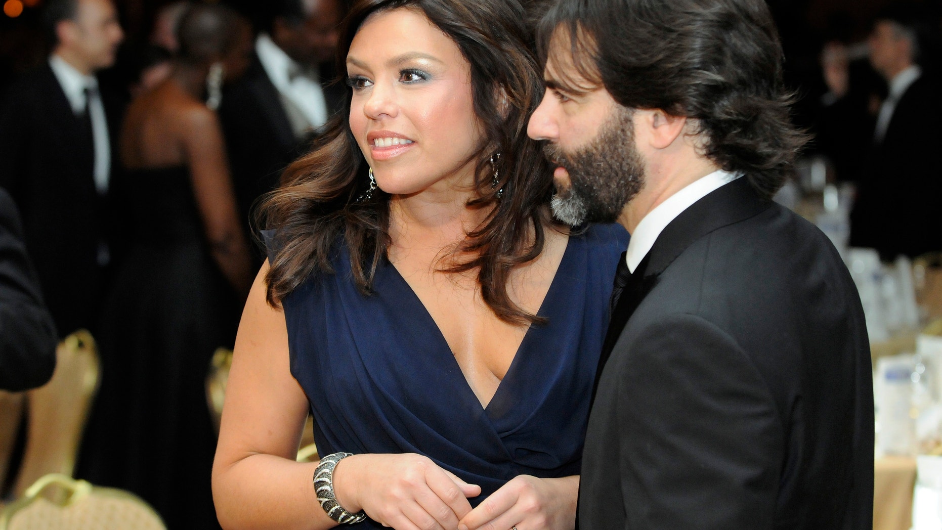 TV food personality Rachael Ray and her husband John Cusimano attend the White House Correspondents' Association Dinner in Washington, May 1, 2010.