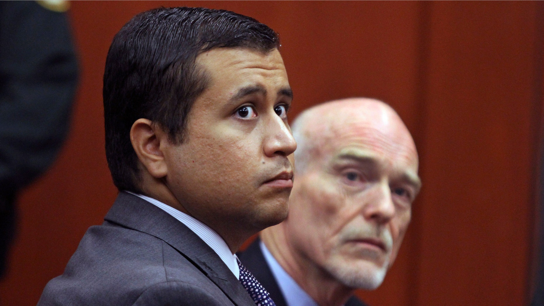 FILE - In this June 29, 2012 file photo, George Zimmerman, left, and attorney Don West appear before Circuit Judge Kenneth R. Lester, Jr. Friday, June 29, 2012, during a bond hearing at the Seminole County Criminal Justice Center in Sanford, Fla. Zimmerman will try to have the murder charge dismissed under Florida's "stand your ground" self-defense law, his attorney said Thursday, Aug. 9, 2012. Zimmerman is charged with second-degree murder in the shooting of Trayvon Martin.(AP Photo/Orlando Sentinel, Joe Burbank, Pool)