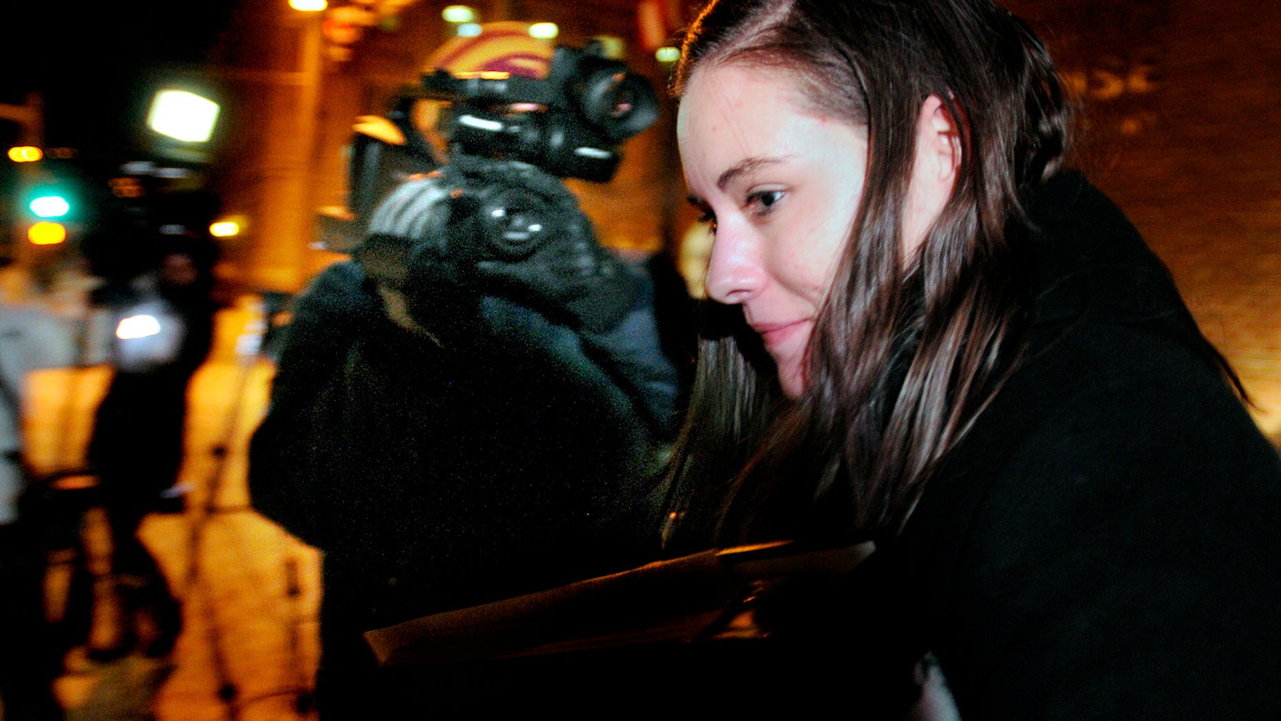 Jordan Graham leaves the Federal Courthouse in Missoula, Mont., Monday, Dec. 9, 2013 after the first day of her murder trial. Graham, 22, is accused of murdering Cody Johnson, her husband of eight days, by pushing him off a cliff in Glacier National Park on July 7. (AP Photo/Missoulian, Kurt Wilson)