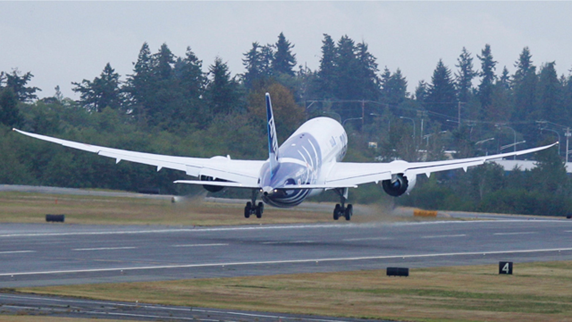 The first Boeing Co. 787 plane delivered to a commercial customer takes off for Japan, Tuesday, Sept. 27, 2011, in Everett, Wash. The plane will be operated by Japan's All Nippon Airways.