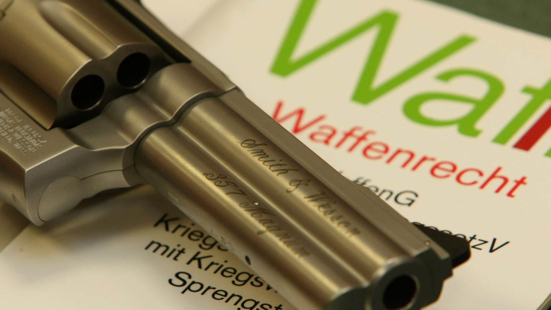 HAMBURG, GERMANY - MARCH 18: A Smith & Wesson Magnum gun and a firearms law book are seen in a gun store on March 18, 2009 in Hamburg, Germany. The recent shooting in the German town of Winnenden that left 16 people dead has brought up the issue of gun control once again in public and media discussions in Germany, though most politicians insist that existing laws are sufficient. Germany has relatively strict gun ownership laws. (Photo illustration by Joern Pollex/Getty Images)