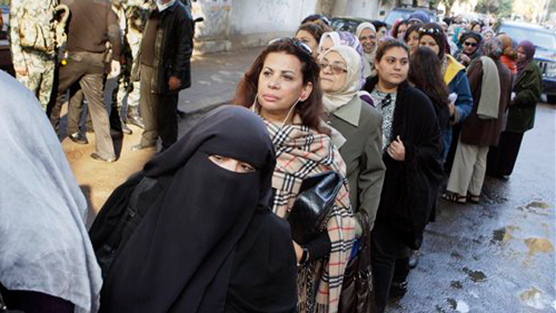 November 28, 2011: Egyptian women line up out side a polling center in Cairo, Egypt.