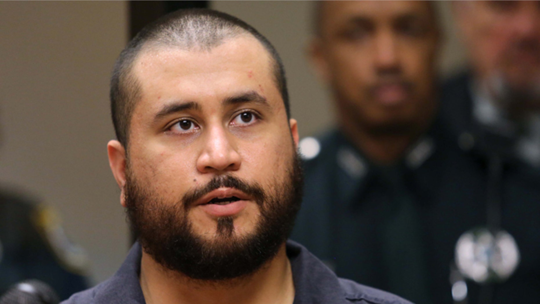 SANFORD, FL - NOVEMBER 19: George Zimmerman the acquitted shooter in the death of Trayvon Martin, answers questions from a Seminole circuit judge during a first-appearance hearing on charges including aggravated assault stemming from a fight with his girlfriend November 19, 2013 in Sanford, Florida. Zimmerman, 30, was arrested after police responded to a domestic disturbance call at a house. He was acquitted in July of all charges in the shooting death of unarmed, black teenager, Trayvon Martin. (Photo by Joe Burbank-Pool/Getty Images)