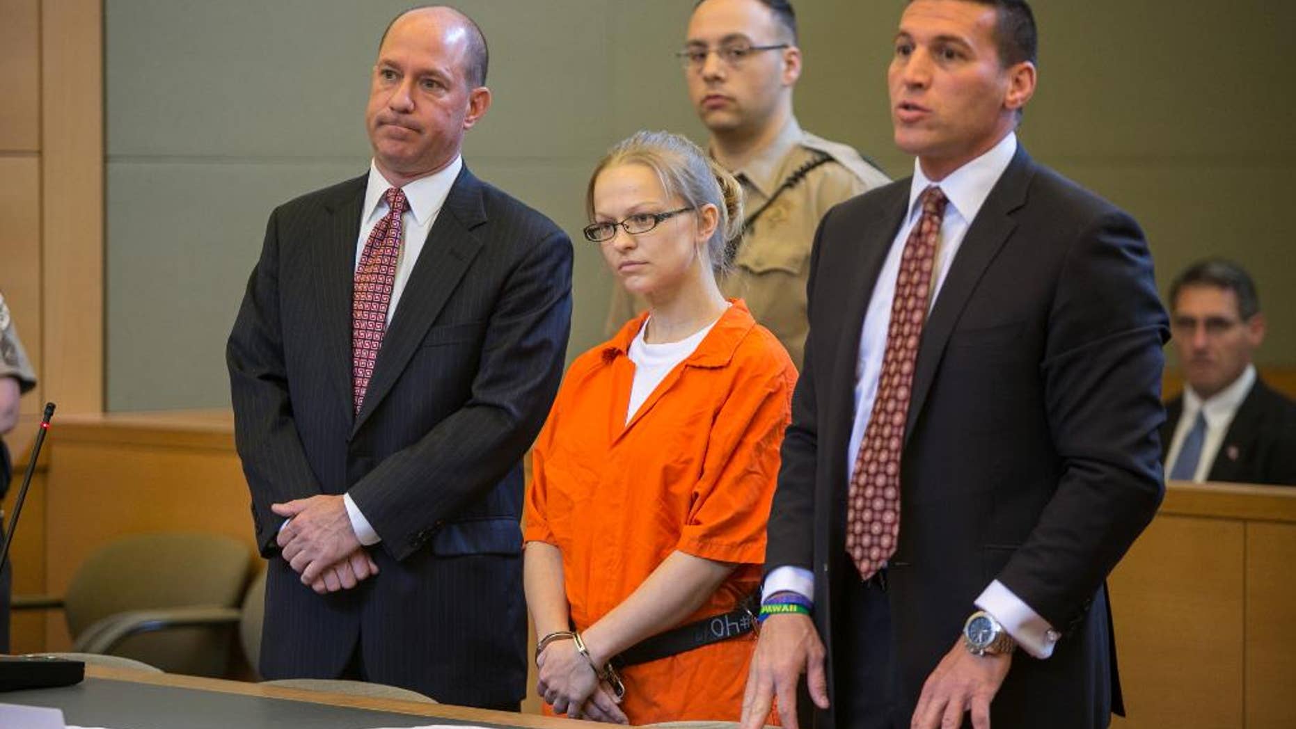 FILE - In this May 29, 2015 file photo, Angelika Graswald, center, stands in court with her attorneys Jeffrey Chartier, left, and Richard Portale at her arraignment in Goshen, N.Y. Authorities say Graswald removed a drain plug from Vincent Viafore's kayak in April 2015 and pushed a floating paddle away from him after his kayak capsized. A Cornwall police officer testified Monday, June 7, 2016, Graswald appeared calm and emotionless after she was rescued. (Allyse Pulliam/Times Herald-Record via AP, Pool, File) MANDATORY CREDIT