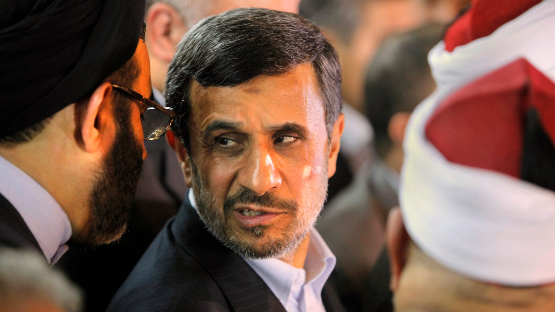 Feb. 5, 2013: Iran's President Mahmoud Ahmadinejad, center, attends a press conference with Egyptian Sunni clerics at Al-Azhar headquarters in Cairo, Egypt. Egypt's most prominent Muslim cleric, the sheik of al-Azhar, has warned Iranian President Mahmoud Ahmadinejad against interfering in Arab Gulf countries or trying to spread Shiite influence.