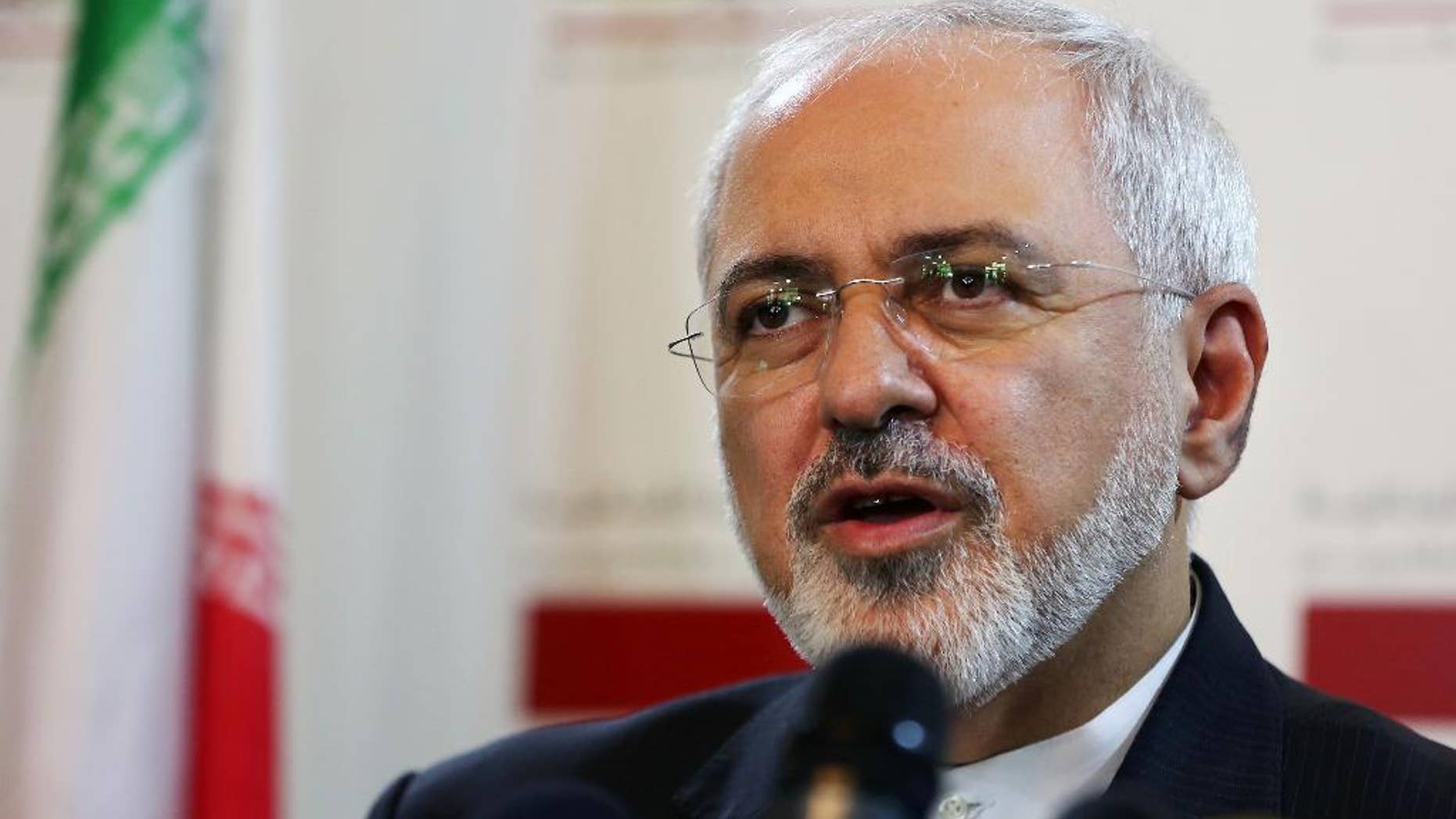 FILE - A Wednesday, Aug. 12, 2015 photo from files showing Iranian Foreign Minister Mohammad Javad Zarif, during a press conference at the Lebanese foreign ministry in Beirut, Lebanon. An unusual secret agreement with a U.N. agency will allow Iran to use its own experts to inspect a site allegedly used to develop nuclear arms, according to a document seen by The Associated Press. (AP Photo/Bilal Hussein, File)