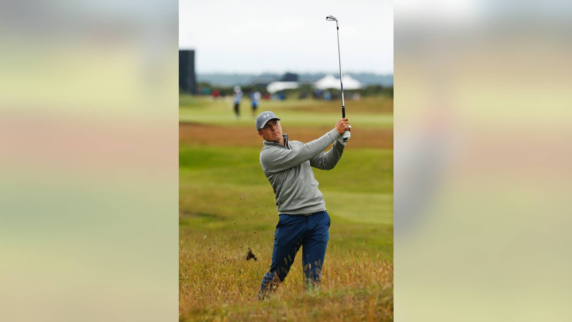 United States’ Jordan Spieth plays a shot from the rough on hole 15 during a practice round at the British Open Golf Championship at the Old Course, St. Andrews, Scotland, Tuesday, July 14, 2015. (AP Photo/Jon Super)