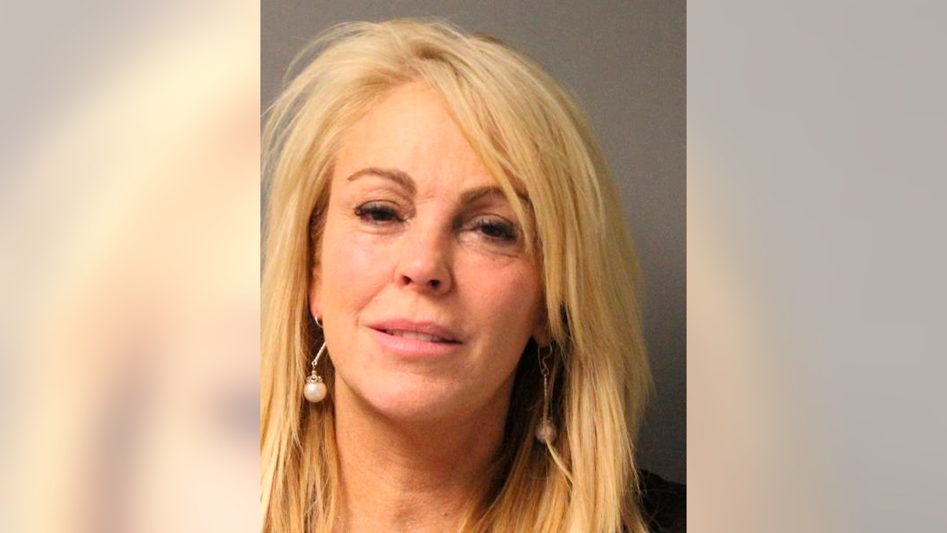 Dina Lohan is pictured in this undated booking photo courtesy of the New York State Police. Lohan, the mother of troubled actress Lindsay Lohan, was arrested and charged with drunken driving on the night of September 12, 2013, after she was stopped for speeding in New York, police said.
