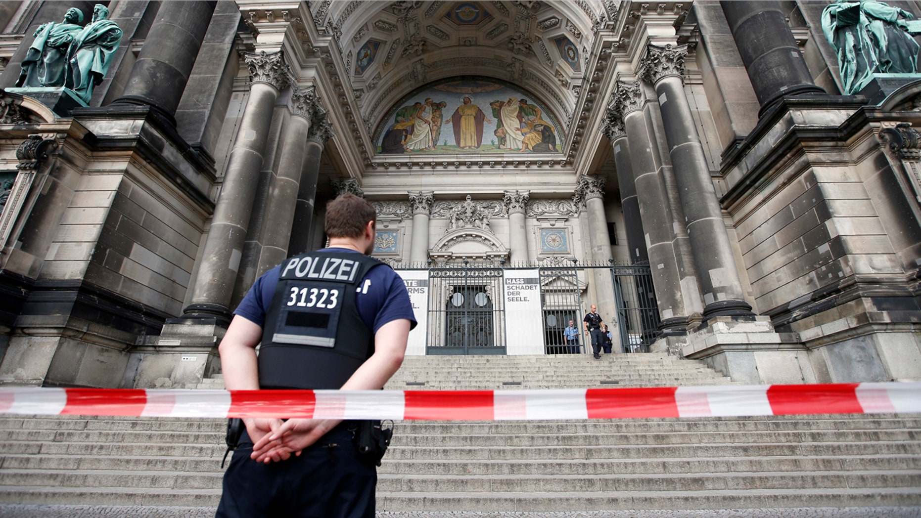 Police opened fire Sunday at a man who was rampaging near Berlin's cathedral, wounding him in the legs.
