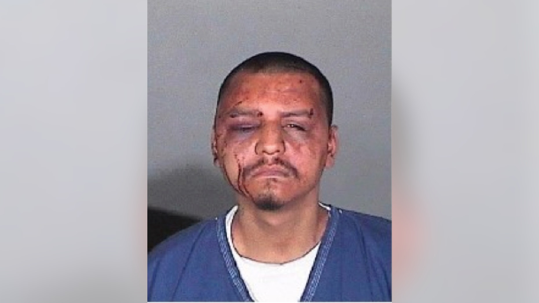 This undated evidence photo provided by the U.S. Attorney's Office shows a mug shot of Gabriel Carrillo taken by the Los Angeles County Sheriff's Department. Two Los Angeles County sheriff's deputies and a sergeant were found guilty Wednesday, June 25, 2015, in the backroom beating of Carrillo, a jail visitor who fellow guards testified already was handcuffed on the ground and covered in blood. Sgt. Eric Gonzalez and Deputy Sussie Ayala were found guilty of conspiracy to violate constitutional rights, deprivation of rights and falsification of records in the 2011 beating of Carrillo. Deputy Fernando Luviano was found guilty of deprivation of rights and falsification of records. (U.S. Attorney's Office via AP)