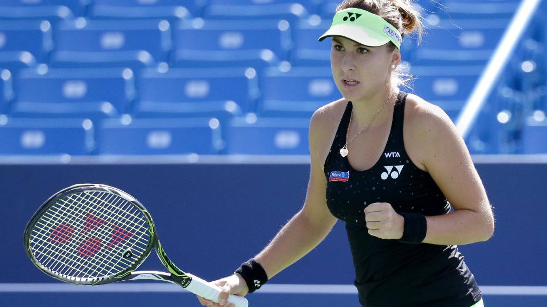 Belinda Bencic, of Switzerland, reacts during a match against Lucie Safarova, of the Czech Republic, at the Western & Southern Open tennis tournament, Thursday, Aug. 20, 2015, in Mason, Ohio. (AP Photo/John Minchillo)"