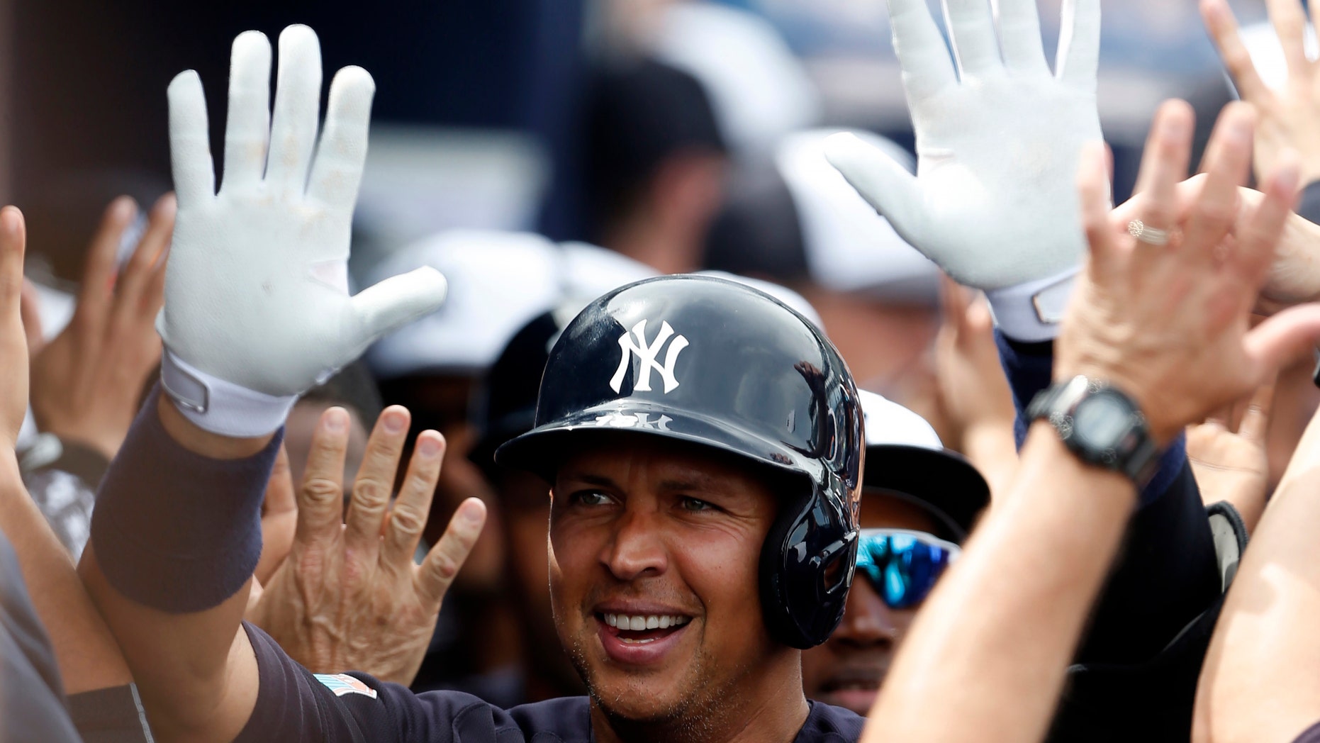 Mar 3, 2016; Tampa, FL, USA; Alex Rodriguez celebrates with high fives as he walks through the dugout after hitting a two run home run against the Philadelphia Phillies (Butch Dill-USA TODAY Sports)