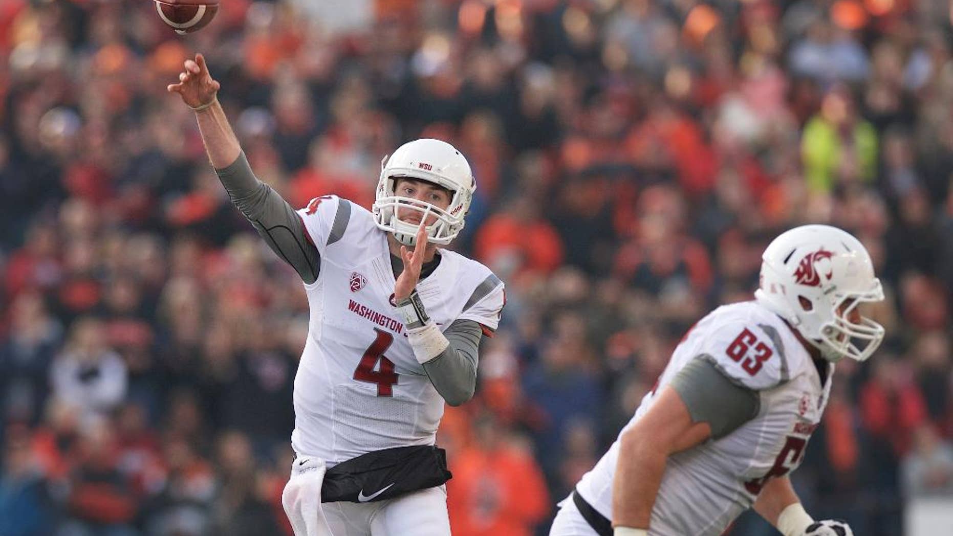 Washington State quarterback Luke Falk (4) throws a pass during an NCAA college football game against Oregon State in Corvallis, Ore., Saturday, Nov. 8, 2014. The Cougars beat the Beavers 39-32. (AP Photo/Troy Wayrynen)