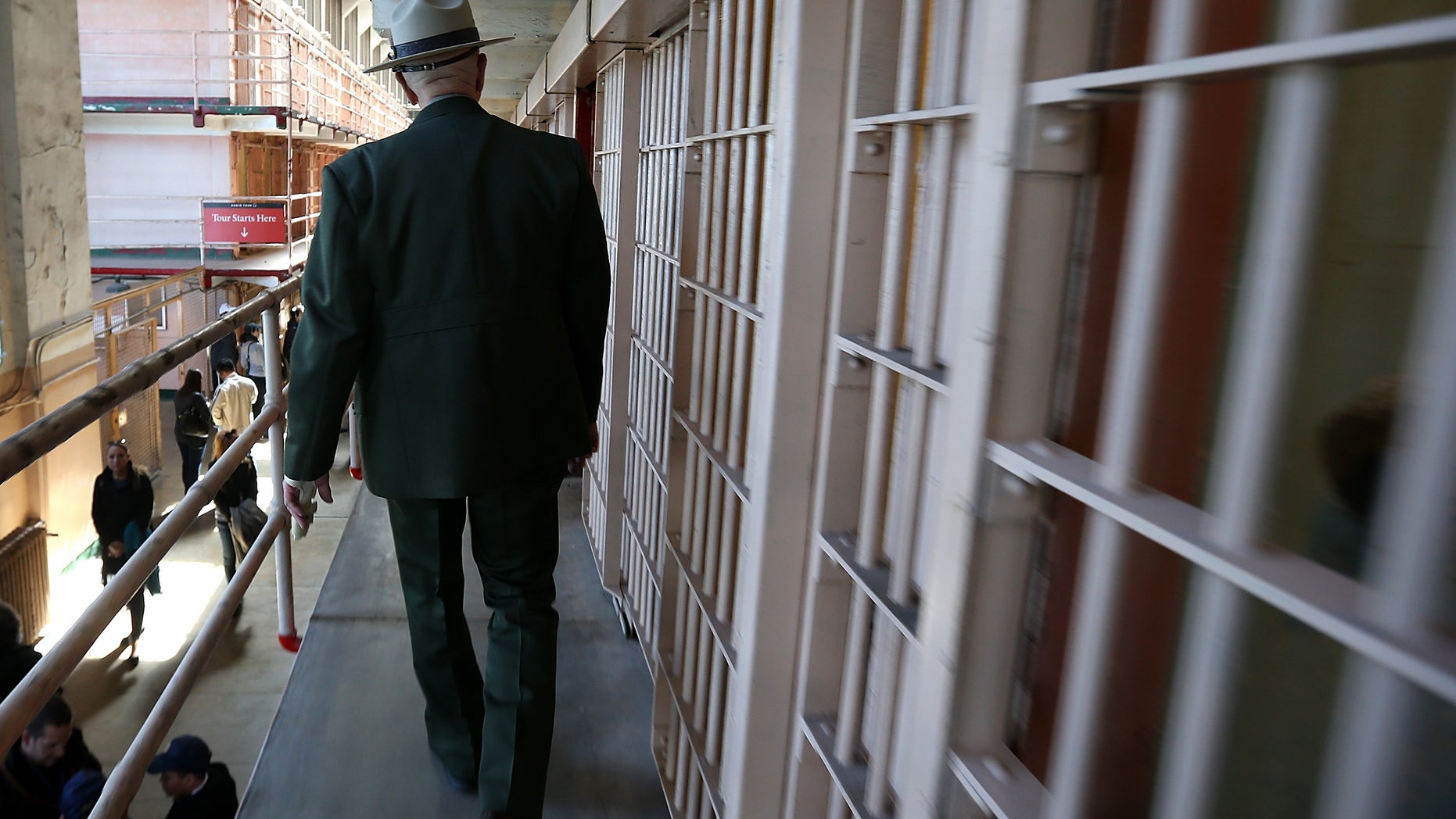 SAN FRANCISCO, CA - MARCH 21: National Park Service ranger Roger Goldberg walks through the main cell block at Alcatraz Island on March 21, 2013 in San Francisco, California. The National Park Service marked the 50th anniversary of the closure of the notorius Alcatraz federal penitentiary with an exhibit of newly discovered photos by Los Angeles freelance photographer Leigh Wiener of the prison's final day in 1963. Alcatraz was first a fort and later became an Army disciplinary barracks before being taken over by the Bureau of Prisons in 1934. (Photo by Justin Sullivan/Getty Images)