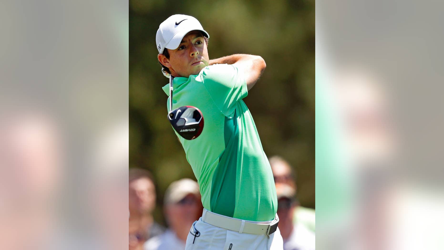 Rory McIlroy, of Northern Ireland, watches his tee shot on the fourth hole during the second round of the Wells Fargo Championship golf tournament in Charlotte, N.C., Friday, May 2, 2014. (AP Photo/Nell Redmond)