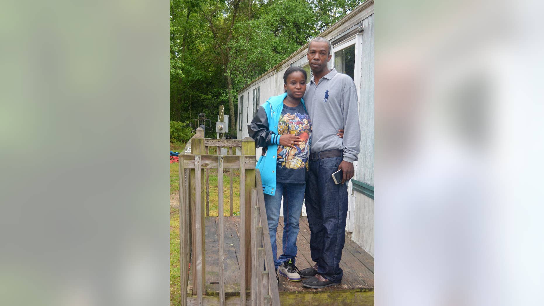 HFM April 13 In this April 12, 2016, photo, Lakeya Hicks and Elijah Pontoon stand outside their home in Aiken, South Carolina. The couple is speaking out about the 2014 traffic stop they say ended in public humiliation over an invasive cavity search for drugs that didn't exist. Hicks and Pontoon are suing the Aiken Department of Public Safety for illegally searching them on the side of a busy road. (AP Photo/Meg Kinnard)