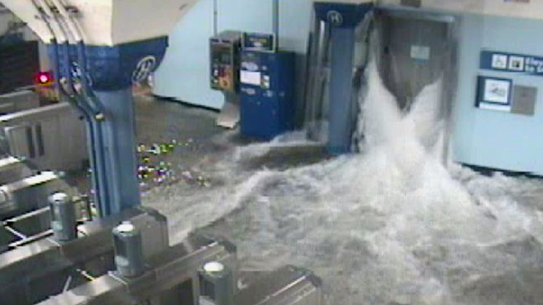 In this photo provided by the Port Authority of New York and New Jersey a surveillance camera captures the PATH station in Hoboken, N.J., as it is flooded shortly before 9:30 p.m. EDT on Monday, Oct. 29, 2012. Sandy continued on its path Monday, as the storm forced the shutdown of mass transit, schools and financial markets, sending coastal residents fleeing, and threatening a dangerous mix of high winds and soaking rain. (AP Photo/Port Authority of New York and New Jersey)