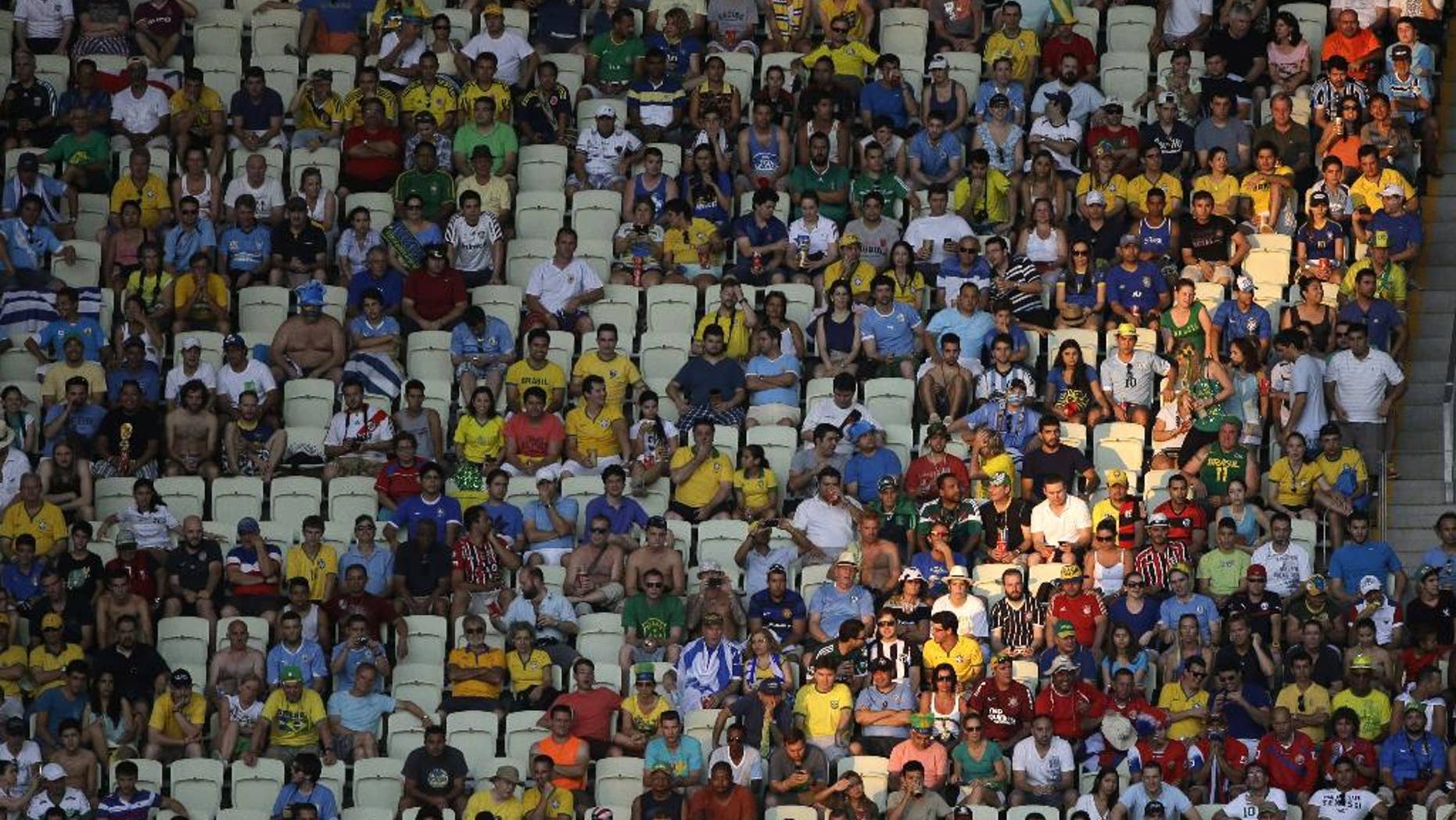 Seats are unoccupied during the group D World Cup soccer match between Uruguay and Costa Rica at the Arena Castelao in Fortaleza, Brazil, Saturday, June 14, 2014. (AP Photo/Sergei Grits)