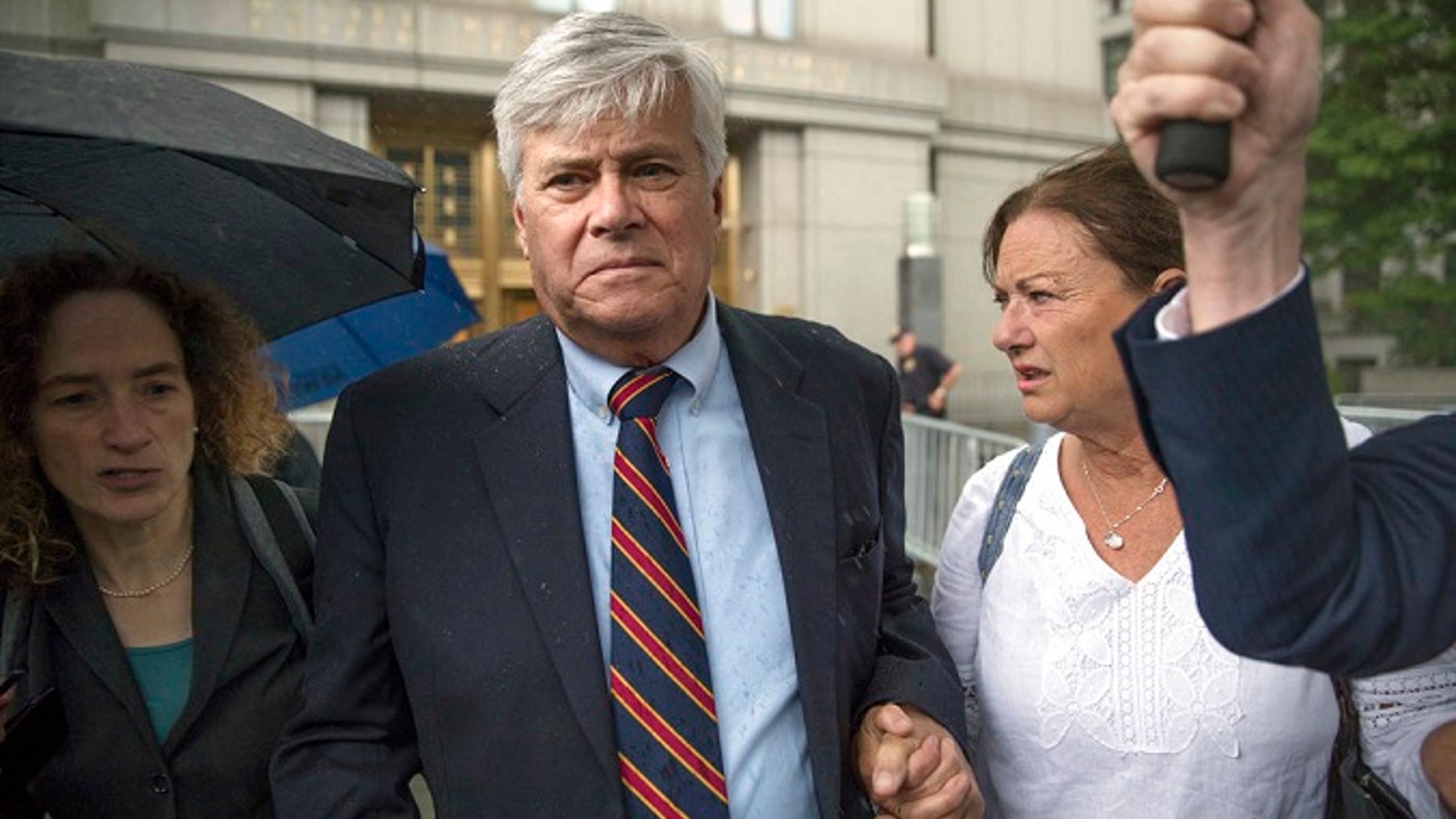 Dean Skelos, center, leaves federal court, Tuesday, July 17, 2018, in New York City. The former New York state Senate leader and his son Adam were convicted on Tuesday of extortion, wire fraud and bribery charges of pressuring businesses to give the son no-show jobs or else risk losing the powerful Republican's political support.