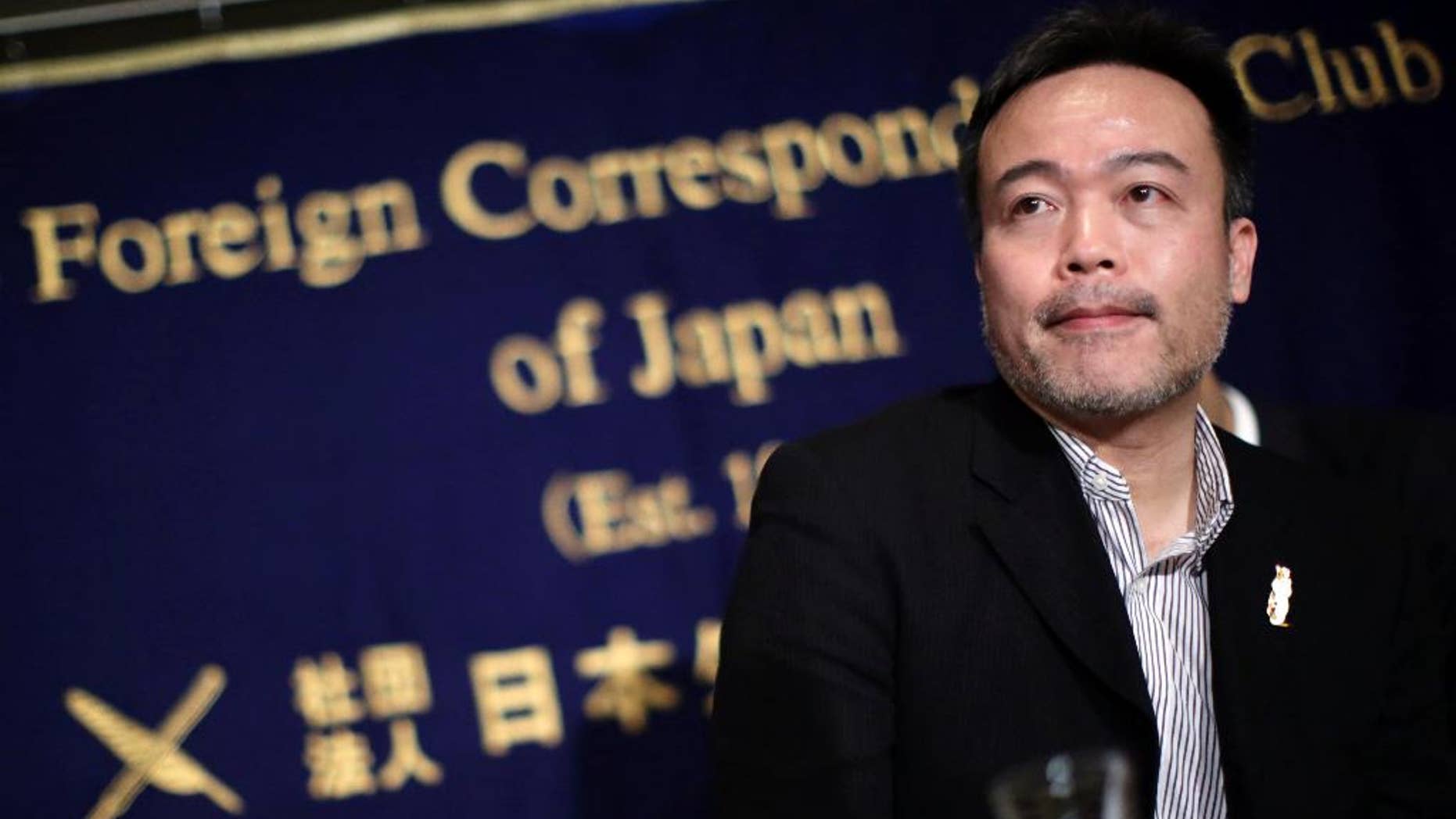 FILE - In this Jan. 22, 2015 file photo, Kosuke Tsuneoka, a Japanese freelance journalist, speaks about the two hostages held by the Islamic State group, at the Foreign Correspondents' Club of Japan in Tokyo. The Japanese freelance journalist covering the fighting in Iraq has been detained by Kurdish authorities. Japanese government spokesman Yoshihide Suga said Tuesday, Nov. 1, 2016 in Tokyo that "we are aware that he is currently being detained" and that Japan is trying to determine why. (AP Photo/Eugene Hoshiko, File)