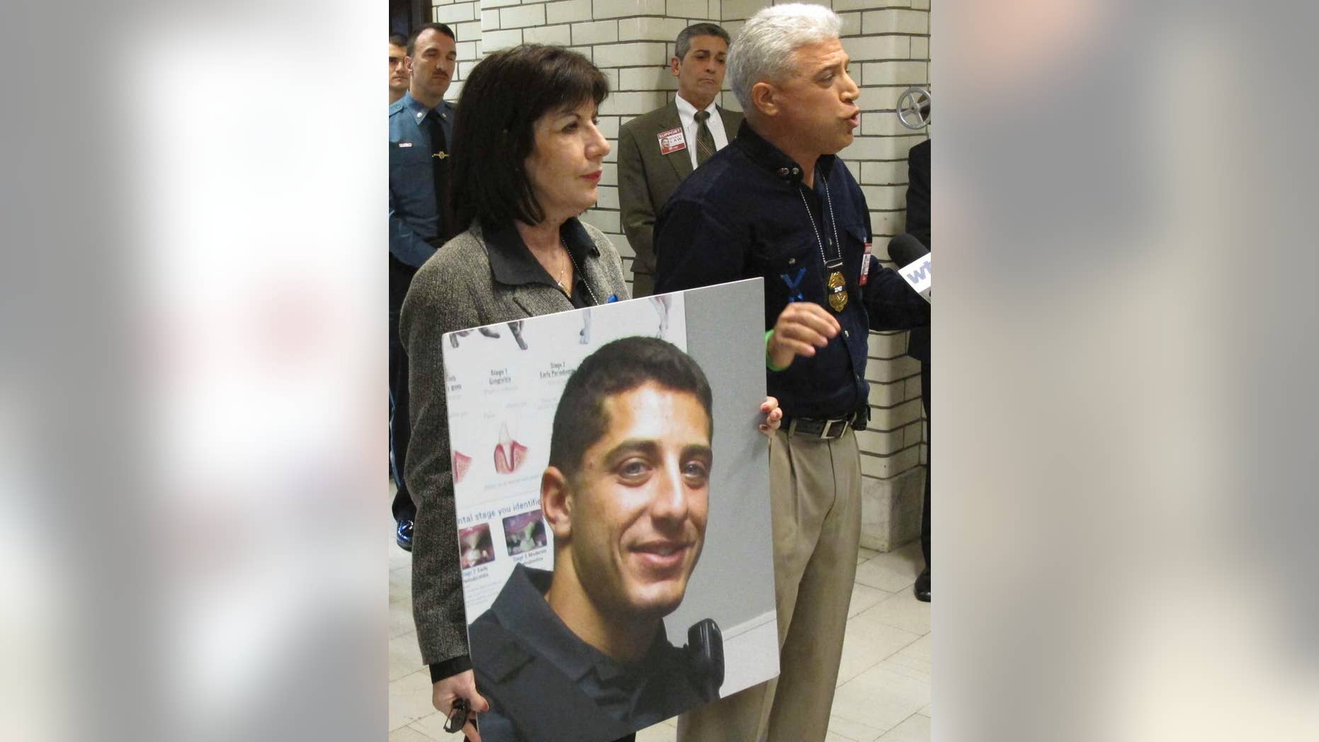 FILE- In this April 9, 2016 file photo, Rich Leotta, the father of police officer Noah Leotta who died after being hit by a suspected drunk driver while on duty last year, addresses Maryland lawmakers in Annapolis, Md. The face of Noah Leotta will appear on ignition interlock devices installed in the vehicles of Maryland motorists convicted of a DUI. (AP Photo/Brian Witte, File)
