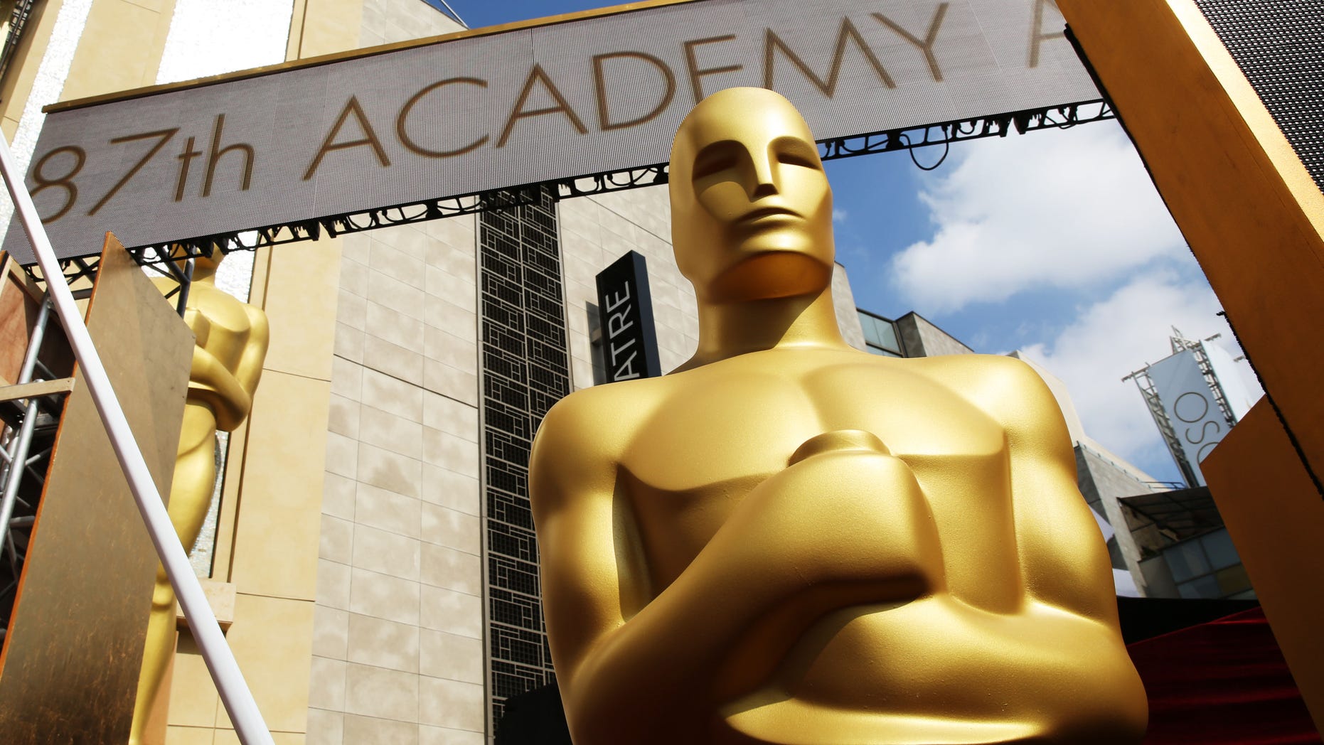 An Oscar statue is seen as preparations are made for the 87th Academy Awards in Los Angeles, Saturday, Feb. 21, 2015. The Academy Awards will be held at the Dolby Theatre on Sunday, Feb. 22. (Photo by Matt Sayles/Invision/AP)