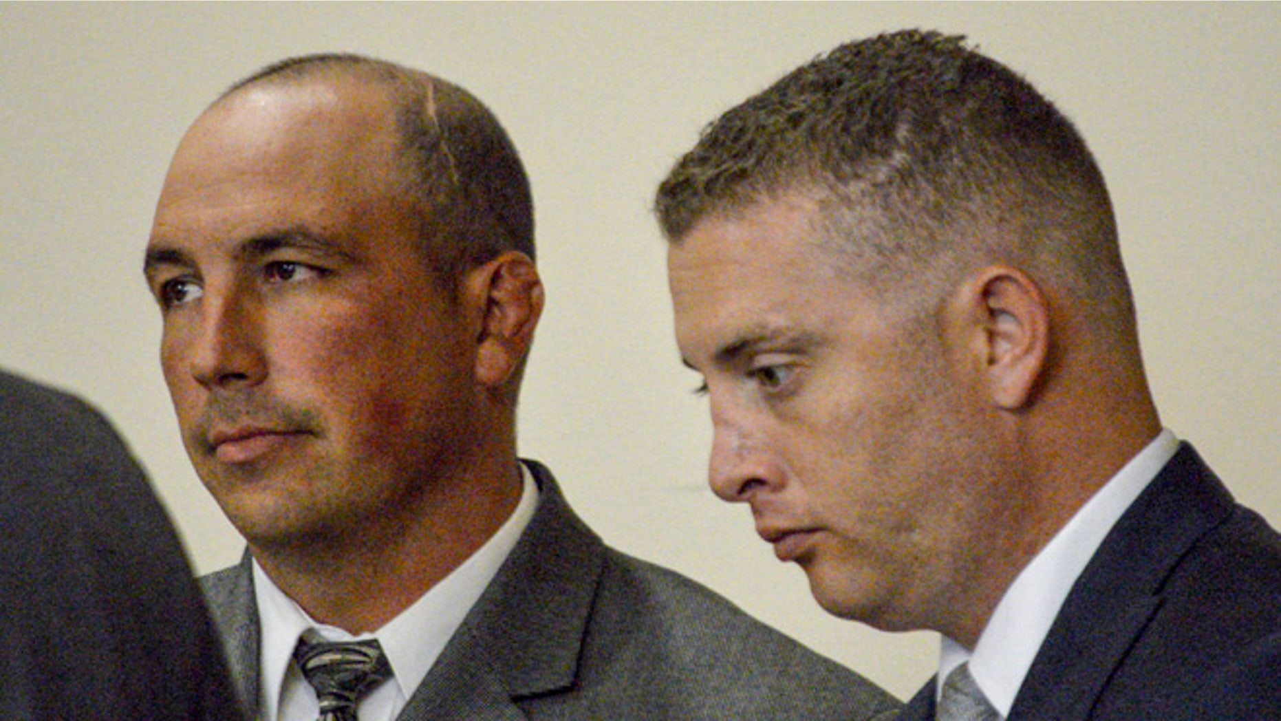 Former Albuquerque Detective Keith Sandy, left, and Officer Dominique Perez on Aug. 18, 2015.