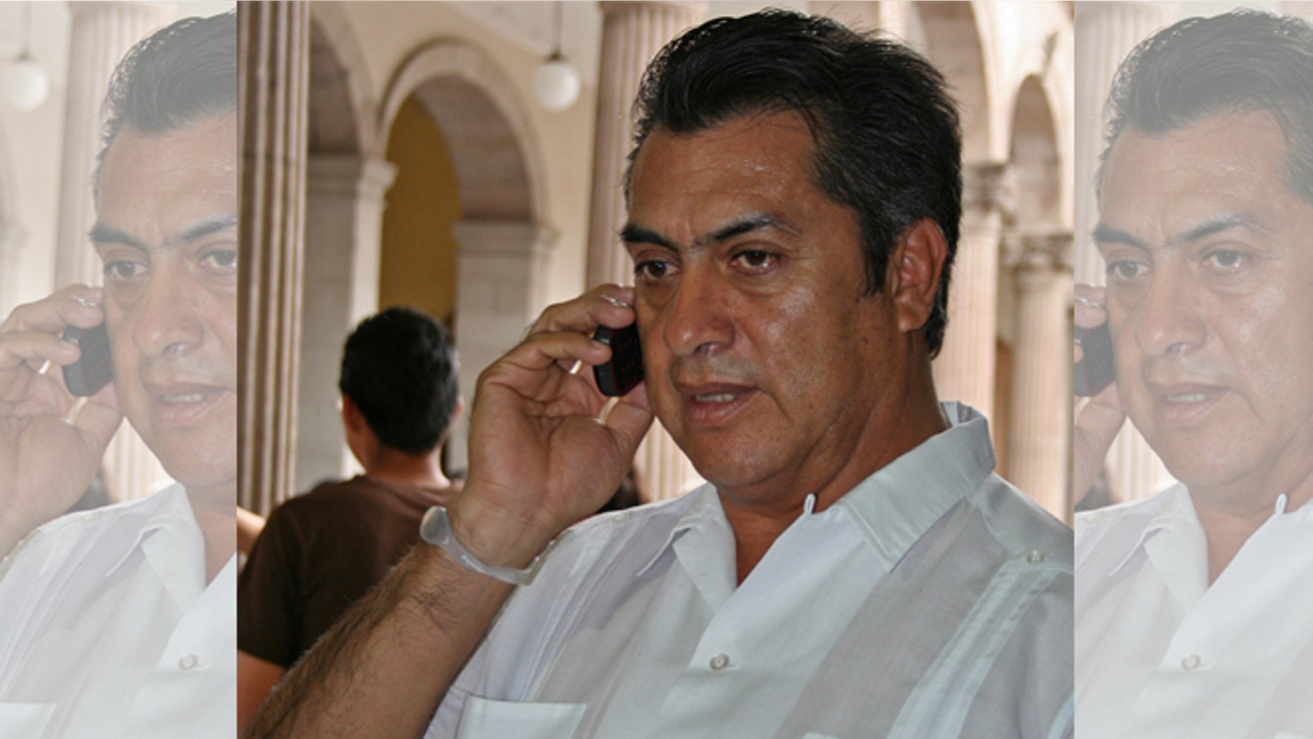 FILE - In this March 30, 2011 file photo, Jaime Rodriguez, mayor of the Mexican town Villa Garcia, speaks on a cellphone in Monterrey, Mexico, a day after he survived an assassination attempt. As mayor of a suburb of the northern industrial city of Monterrey, Rodriguez survived two assassination attempts that left his car bullet-ridden, defying, he says, the fierce Zetas cartel. Now he is trying to beat the odds in another way, running as an independent for governor of Nuevo Leon, a wealthy and strategic state bordering Texas. (AP Photo, File)