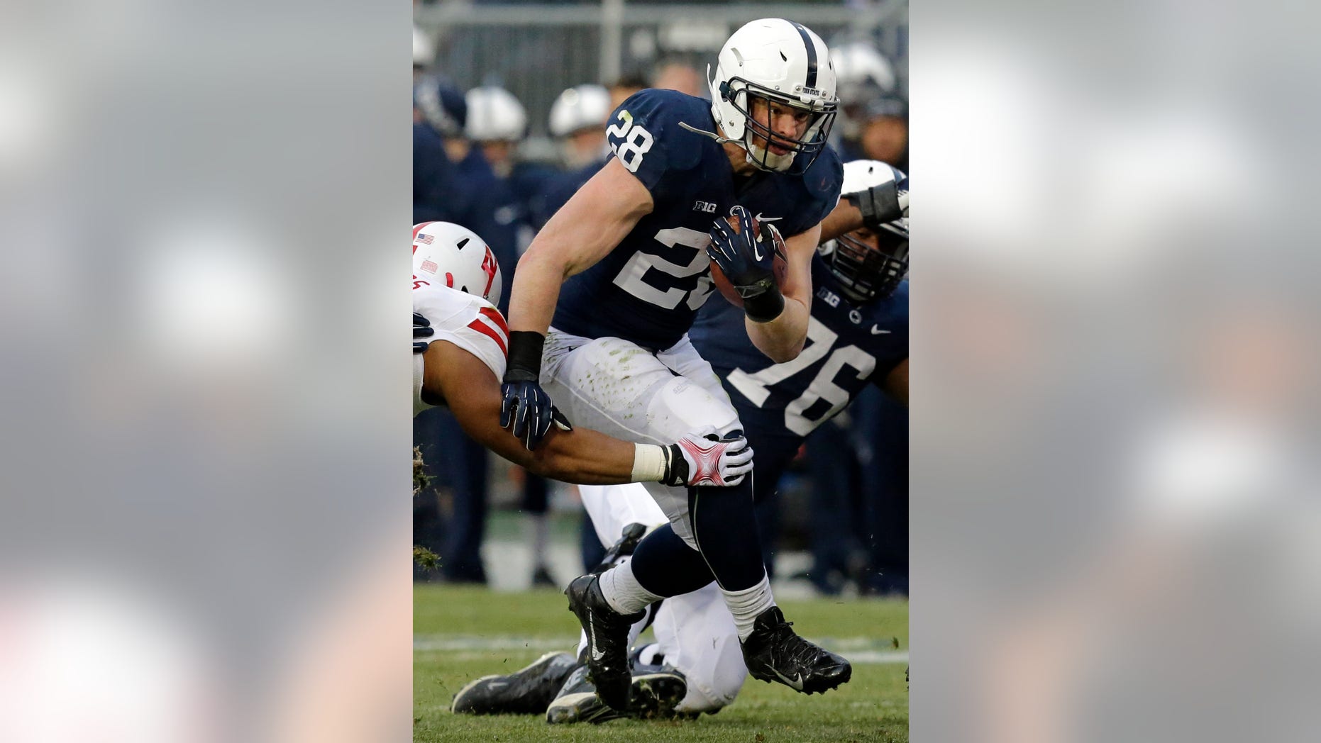 Penn State running back Zach Zwinak (28) carries the ball during the first quarter of an NCAA college football game against Nebraska in State College, Pa., Saturday, Nov. 23, 2013. (AP Photo/Gene J. Puskar)