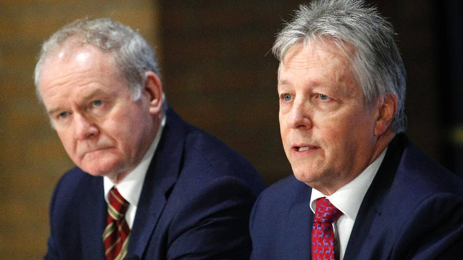 FILE - This is a Friday, Dec. 5, 2014 file photo of Northern Ireland deputy First Minister Martin McGuinness, left, and Northern Ireland First Minister Peter Robinson attend a press conference at The Royal School Armagh, Northern Ireland. Government officials say the prime ministers of Britain and Ireland, David Cameron and Enda Kenny, will travel to Belfast later this week in hopes of forging an agreement to sustain Northern Ireland’s fraying unity government. The planned arrival of both leaders Thursday Dec. 11, 2014 signals increased concern that the 7 ½-year-old coalition of British Protestants and Irish Catholics, a key peacemaking achievement, could collapse without a new compromise pact at their Stormont government headquarters in east Belfast. (AP Photo/Peter Morrison, File)