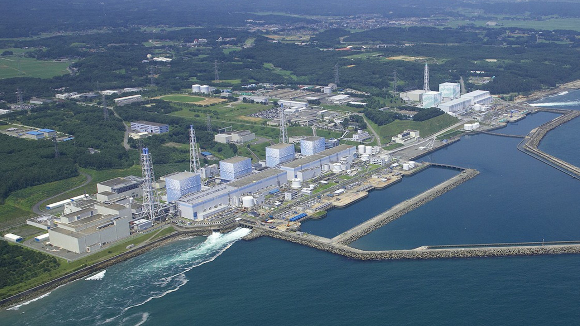 The Fukushima Daiichi Nuclear Power Plant reactors stand in line intact in Okuma town in Fukushima Prefecture, northeastern Japan. Radiation has covered the area around the Fukushima Dai-ichi plant and blanketed parts of the complex, making the job of rendering the plant safe so that it doesn't threaten public health and the environment, or "decommissioning", a bigger task than usual.