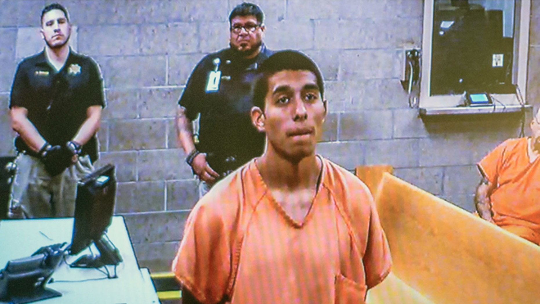 Alex Rios,18, makes an appearance on video for an arraignment in metro court Monday, July 21, 2014 for participating in the beating of two homeless men on the westside in Albuquerque, New Mexico over the weekend. (AP Photo/Albuquerque Journal, Roberto E. Rosales)