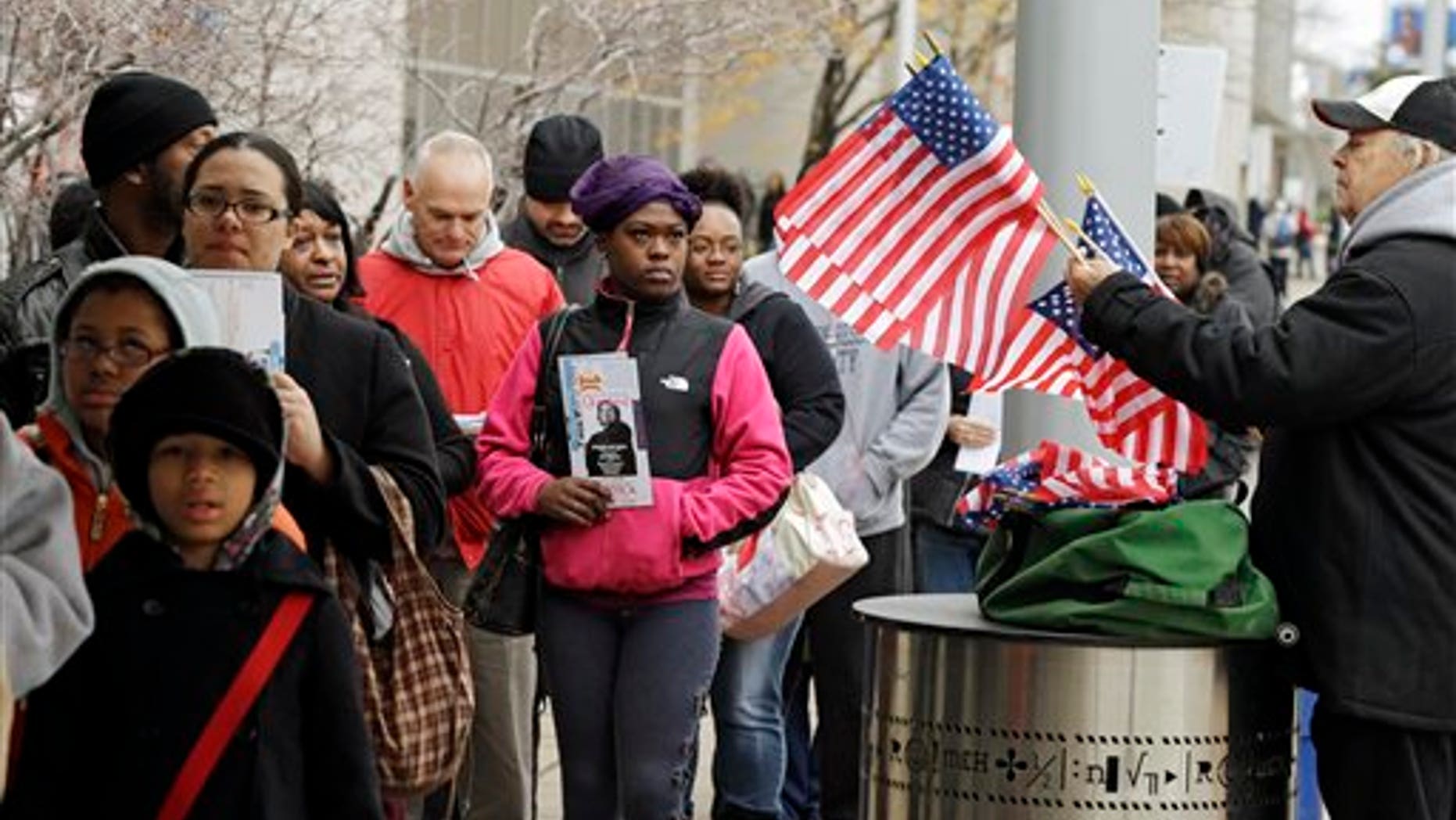 Voiters wait in line outside the Cuyahoga County Board of Elections in Cleveland on the final day of early voting Monday, Nov. 5, 2012. About 1.6 million people have voted early in Ohio. (AP Photo/Mark Duncan)