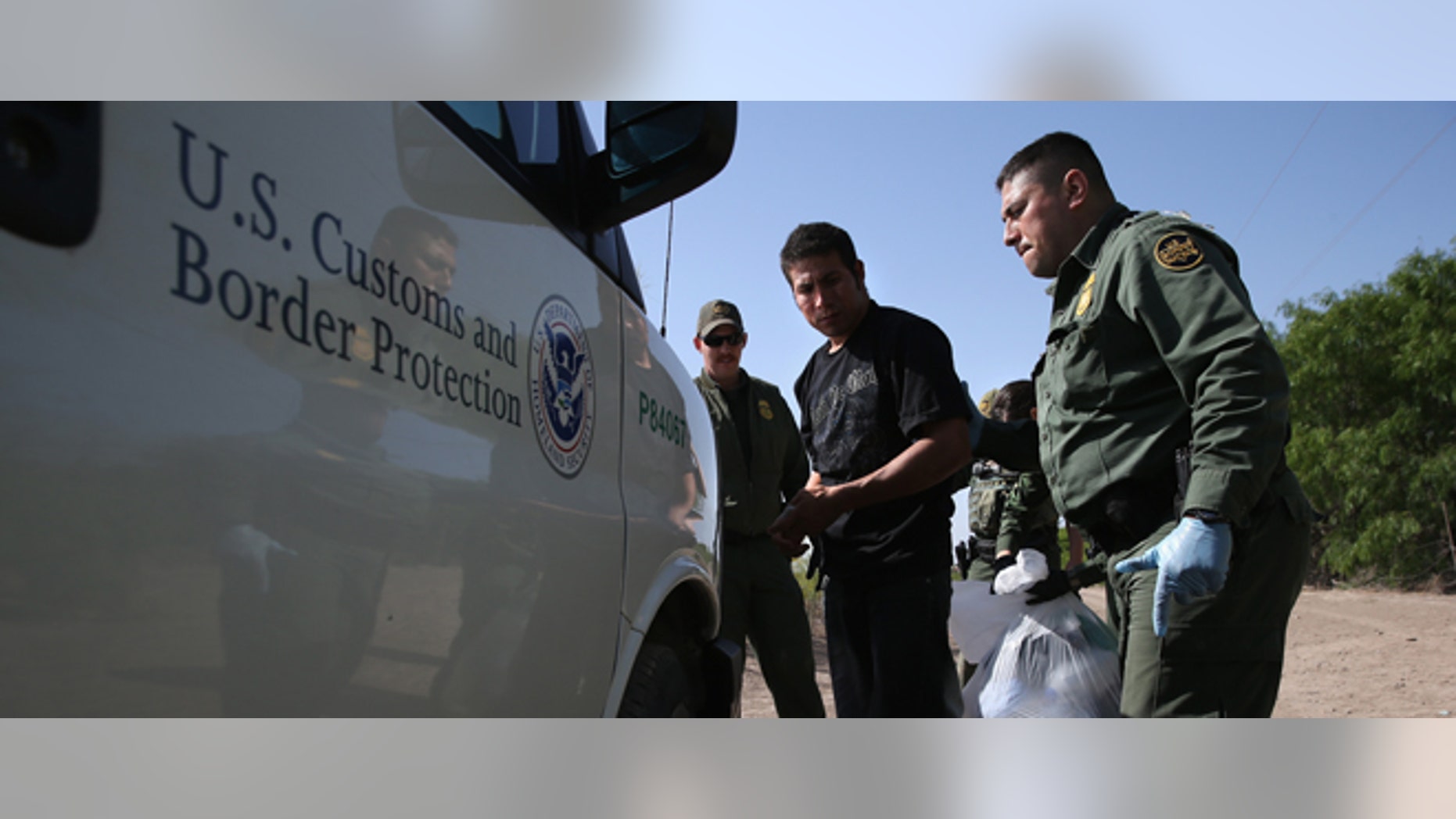 MISSION, TX - APRIL 11: U.S. Border Patrol agents detain undocumented immigrants near the U.S.-Mexico border on April 11, 2013 near Mission, Texas. A group of 16 immigrants from Mexico and El Salvador said they crossed the Rio Grande River from Mexico into Texas during the morning hours before they were caught. The Rio Grande Valley sector of has seen more than a 50 percent increase in illegal immigrant crossings from last year, according to the Border Patrol. Agents say they have also seen an additional surge in immigrant traffic since immigration reform negotiations began this year in Washington D.C. Proposed refoms could provide a path to citizenship for many of the estimated 11 million undocumented workers living in the United States. Photo by John Moore/Getty Images) (Photo by John Moore/Getty Images)