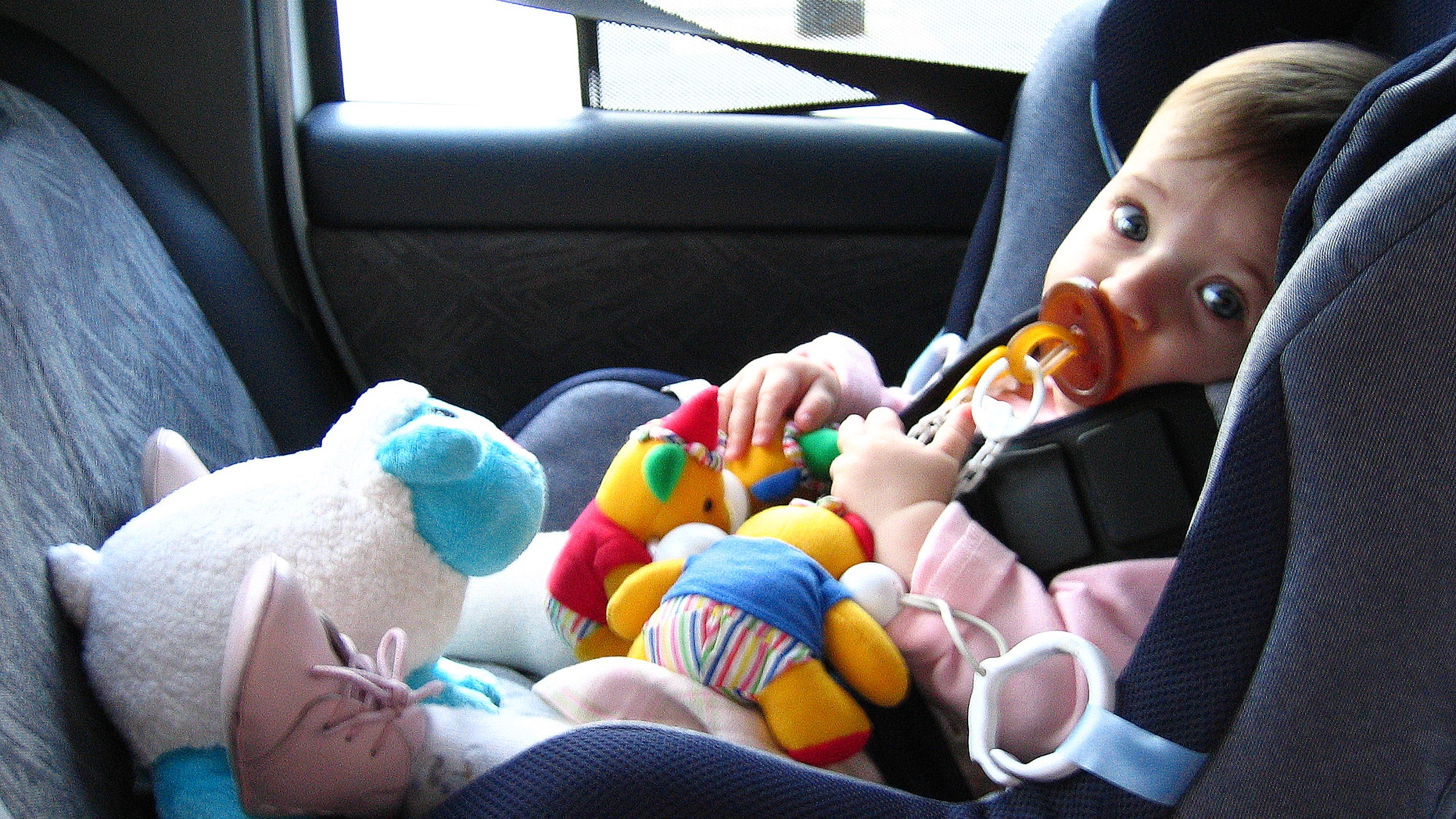 Toddler sitting in car seat. (Photo by Fernando Camino/Cover/Getty Images)