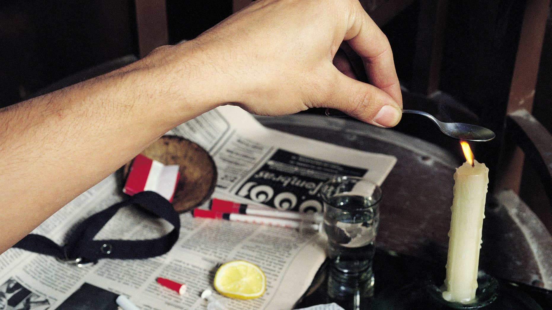 Heroin user preparing his fix Heroin addict heats the drug next to the necessary material to prepare his fix (Photo by Rafa Samano/Cover/Getty Images)