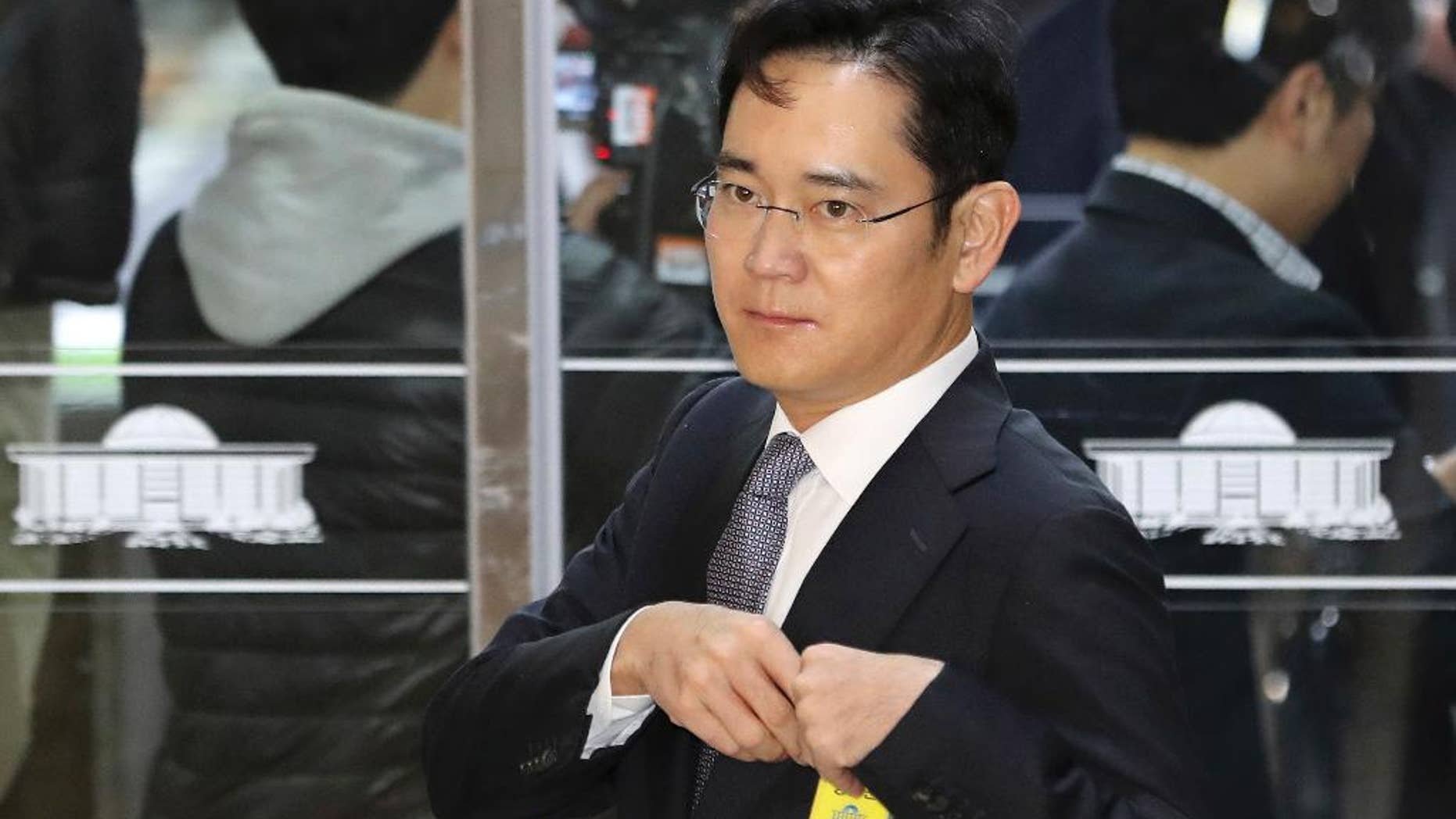 Lee Jae-yong, a vice chairman of Samsung Electronics Co. arrives for hearing at the National Assembly in Seoul, South Korea, Tuesday, Dec. 6, 2016. South Korea's most powerful business leaders from Samsung, Hyundai Motor and six other companies face grilling as lawmakers probe their links to a corruption scandal involving South Korea's president and her confidante. (AP Photo/Lee Jin-man)