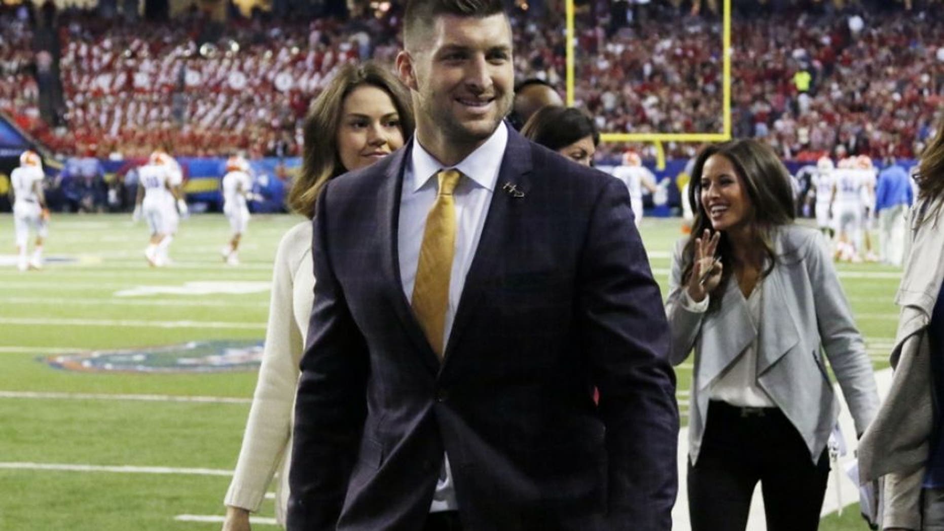 Dec 5, 2015; Atlanta, GA, USA; Florida Gators former quarterback Tim Tebow on the sideline during the game against the Alabama Crimson Tide in the 2015 SEC Championship Game at the Georgia Dome. Mandatory Credit: Brett Davis-USA TODAY Sports