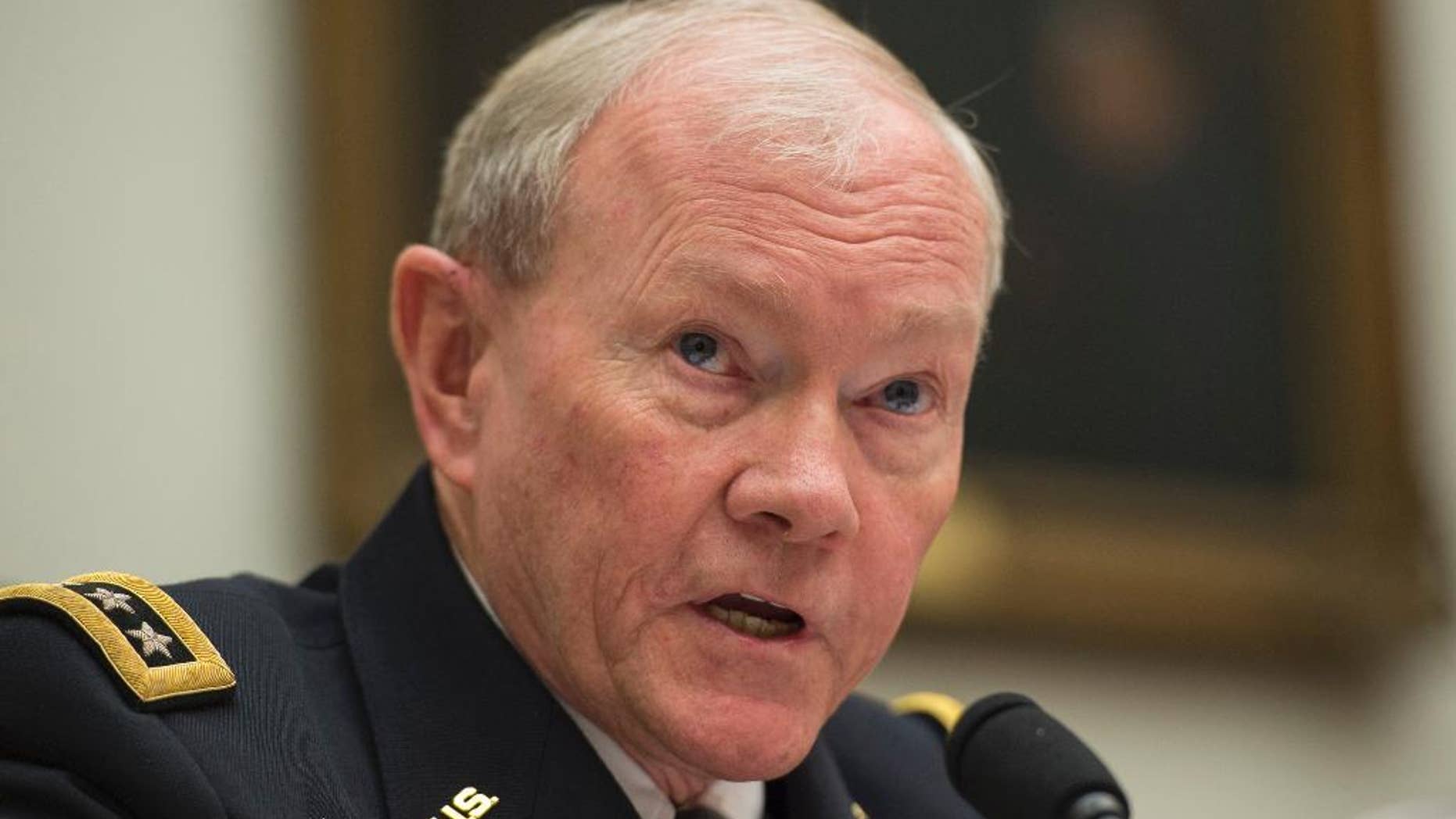 FILE - In this March 18, 2015, file photo, Joint Chiefs Chairman Gen. Martin Dempsey testifies on Capitol Hill in Washington. In the homestretch of a 41-year U.S. Army career shaped by war and the scars from it, Dempsey does not hide his skepticism that Iraq will find its own path to lasting victory over the Islamic State group. But neither does he say the threats to Iraq today justify sending American ground troops back into combat. He counsels patience, for now. (AP Photo/Molly Riley, File)