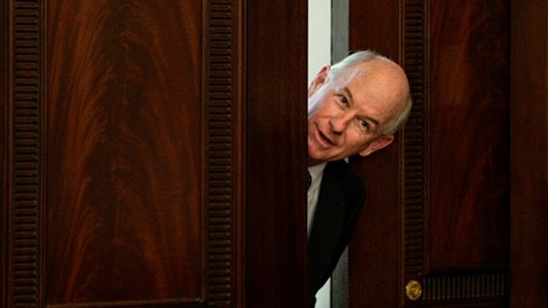 In this photo taken July 31, 2009, P. J. Crowley, communications director at the State Department, peeks out of a doorway of the Franklin Room at the Department of State in Washington. American diplomacy has stepped up online efforts as Facebook, YouTube, Flickr and Twitter play a growing role in events around the world. Recently Crowley has tweeted to knock down rumors, amplify U.S. policy positions, appeal for calm and urge reforms in Haiti, Tunisia and Lebanon. And before he addressed the the press corps about the return to Haiti of former dictator Jean-Claude "Baby Doc" Duvalier, Crowley pronounced the U.S. position on Twitter. (AP Photo/J. Scott Applewhite)