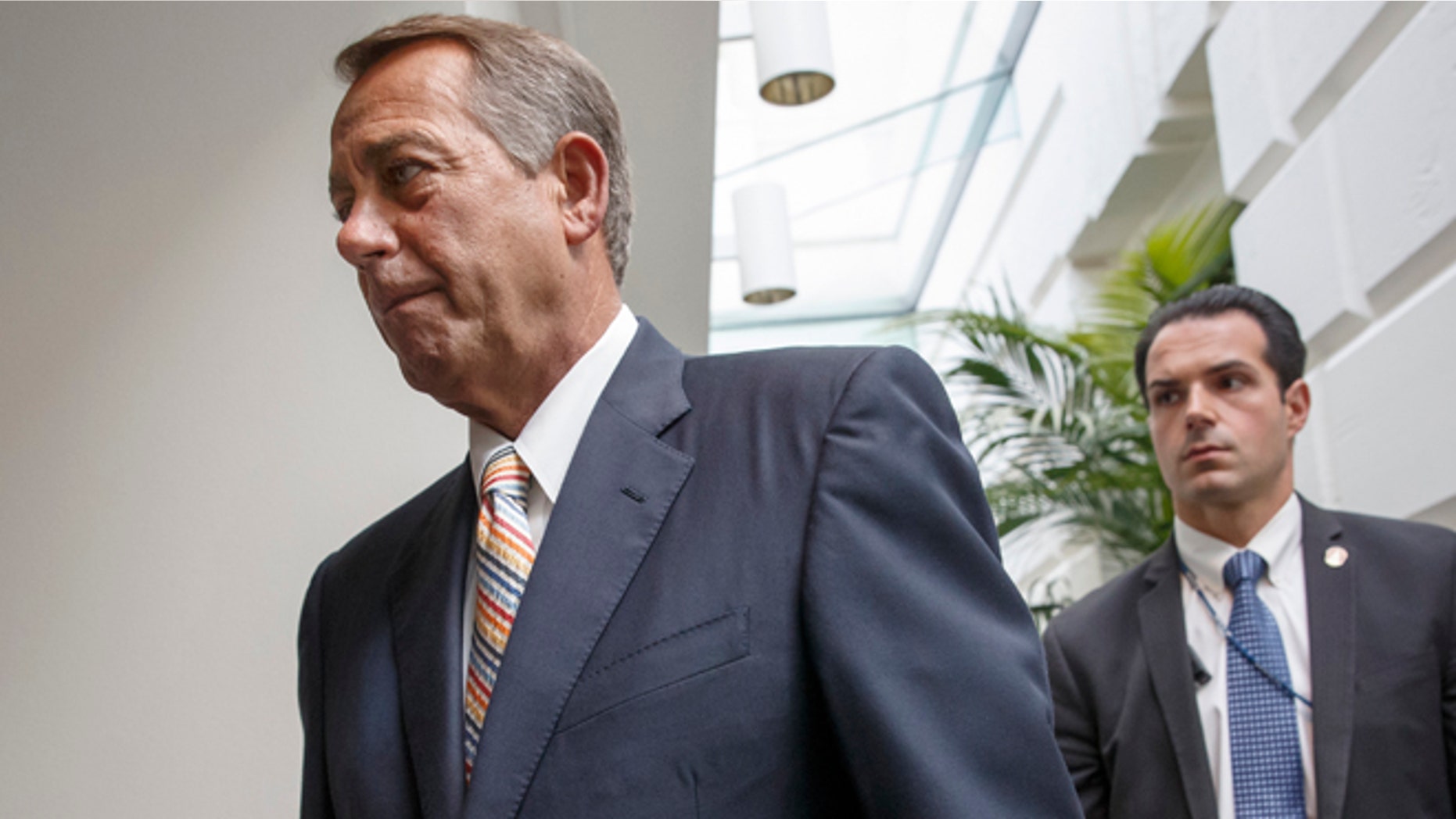Speaker of the House John Boehner, R-Ohio, arrives for a meeting of the Republican Conference on Capitol Hill in Washington, Tuesday, July 29, 2014. (AP Photo/J. Scott Applewhite)