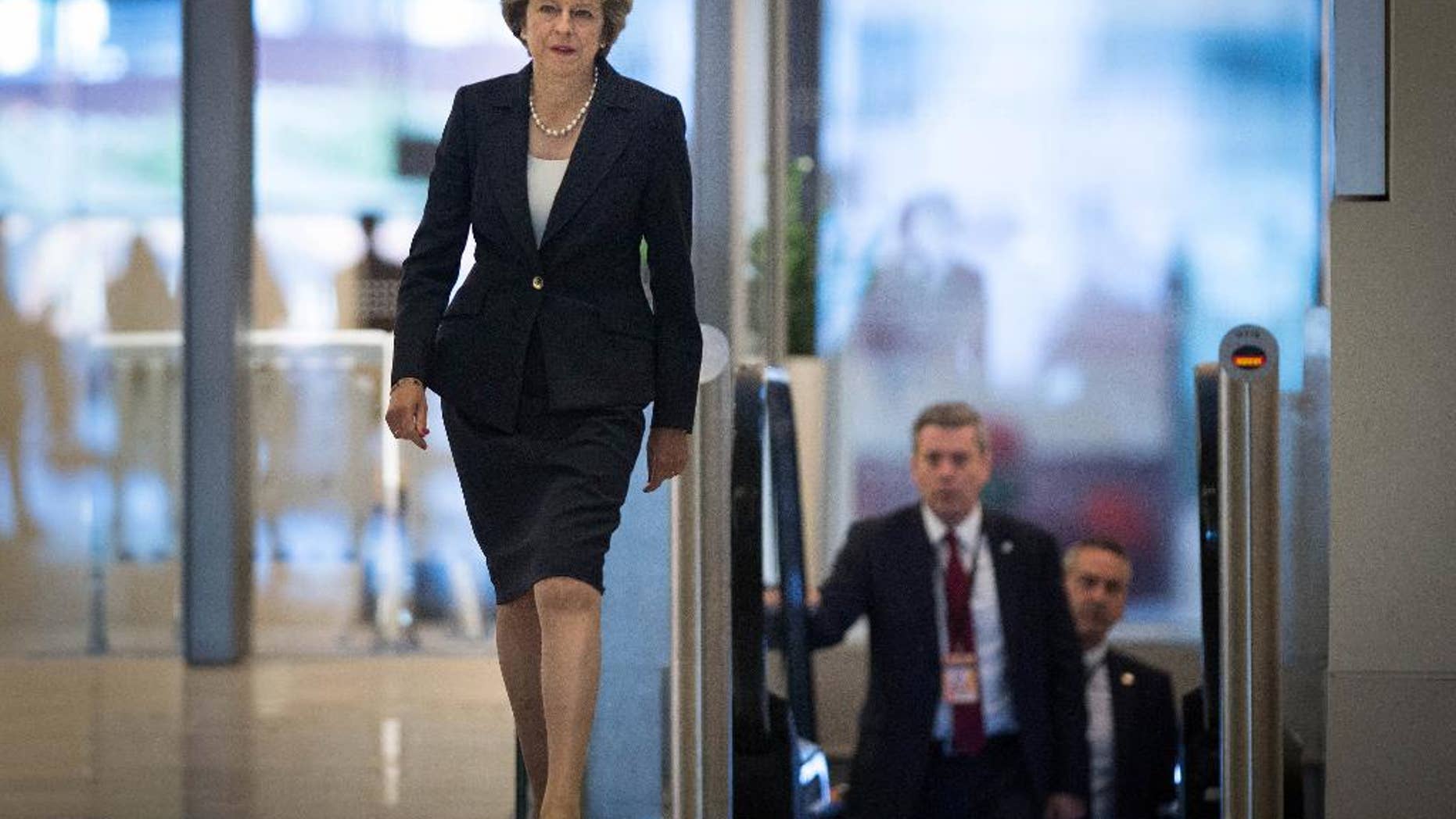 Britain's Prime Minister Theresa May arrives ahead of a TV interview at BBC studios in Birmingham, England, before the start of the annual Conservative party conference, Sunday Oct. 2, 2016. During the interview May said Britain will trigger the Article 50 formal process for leaving the European Union, Brexit, before the end of March 2017, setting the nation on a course to leave the 28-nation European trading bloc by 2019. (Stefan Rousseau / PA via AP)