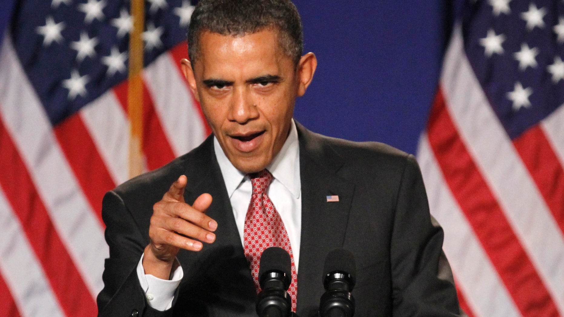 In this photo taken Friday, Sept. 16, 2011, President Barack Obama gestures while speaking in Alexandria, Va.