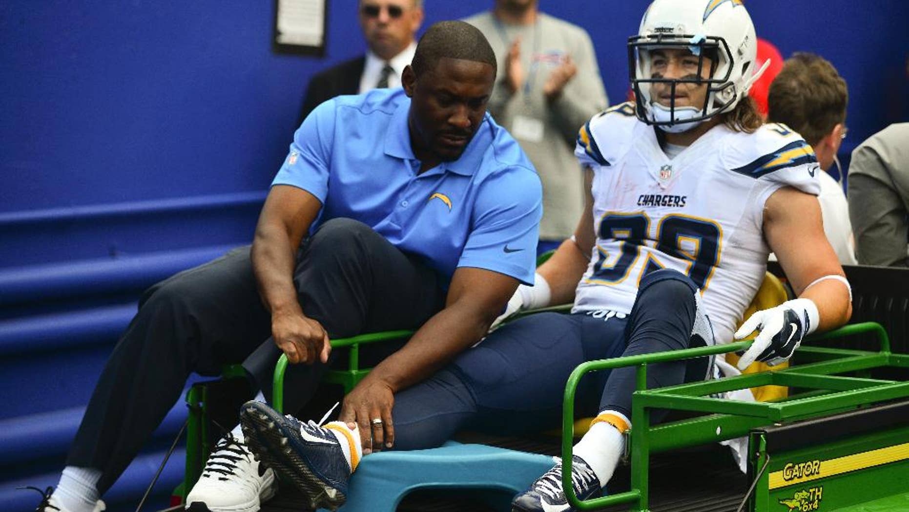 San Diego Chargers running back Danny Woodhead (39) is carted off the field after being injured on a play during the first half of an NFL football game against the Buffalo Bills, Sunday, Sept. 21, 2014, in Orchard Park, N.Y. (AP Photo/Gary Wiepert)