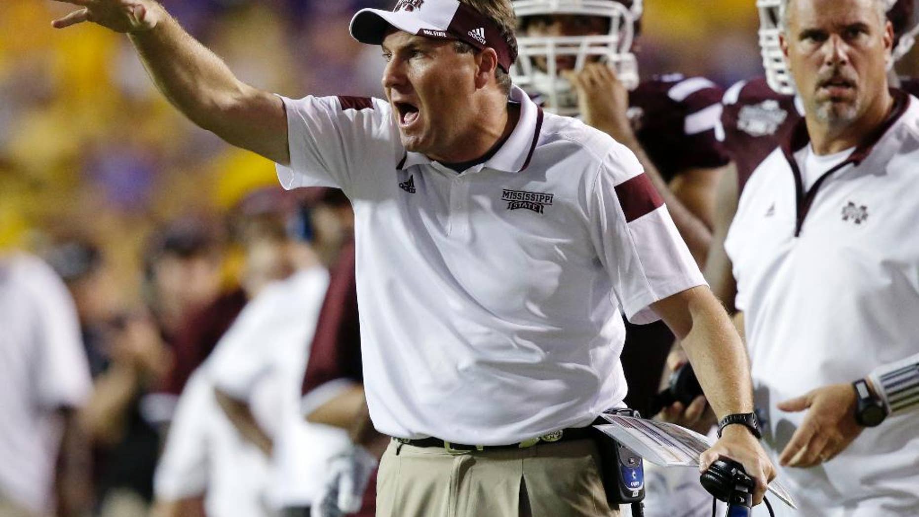 Mississippi State head coach Dan Mullen calls out from the sideline in the second half of an NCAA college football game in Baton Rouge, La., Saturday, Sept. 20, 2014. Mississippi State won 34-29. (AP Photo/Gerald Herbert)