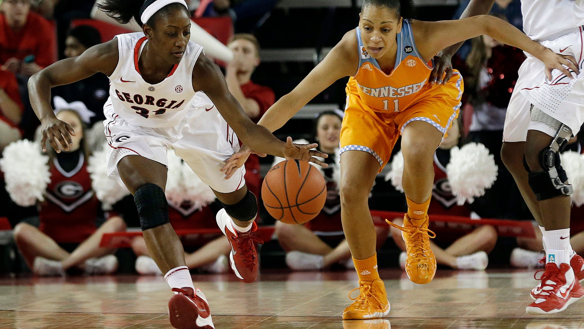 FILE - In this Jan. 5, 2014 file photo, Georgia guard Erika Ford, left, and Tennessee forward Cierra Burdick (11) chase down a loose ball in the first half of an NCAA college basketball game in Athens, Ga. Georgia has dropped out of the Top 25 after a 0-4 start in the SEC. (AP Photo/John Bazemore, File)