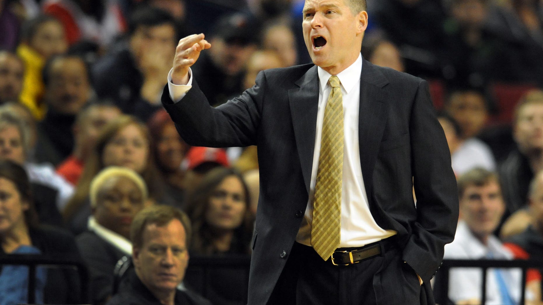 Sacramento Kings head coach Michael Malone yells out to the officials during the first half of an NBA basketball game against the Portland Trail Blazers onSunday, Oct. 20, 2013, in Milwaukee. (AP Photo/Steve Dykes)