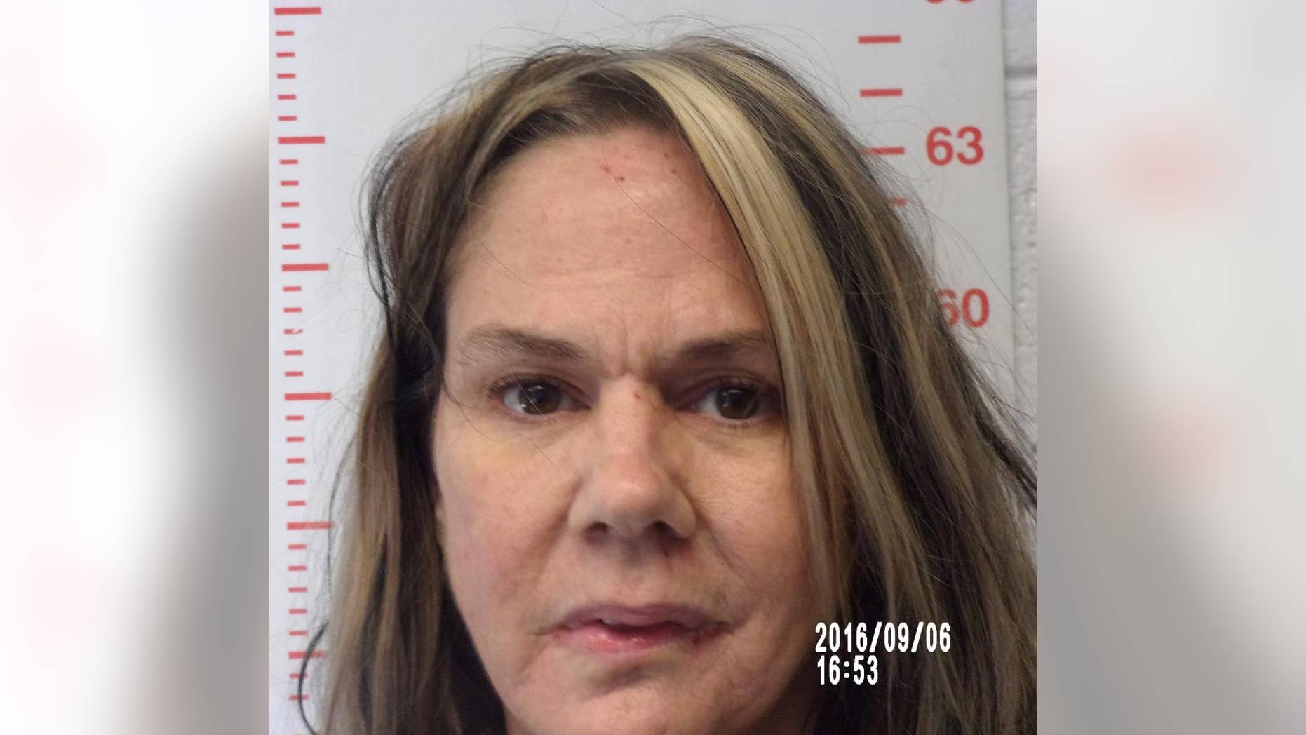 This Sept. 6, 2016 photo provided by the Polk County Sheriff's Office in Bolivar, Mo., shows Kimberly Lightwine, of Aldrich, Mo. Lightwine, who was found lying near the body of her blind and autistic son in a field near Morrisville, Mo., on Aug. 29, was charged Saturday, Sept. 3, with second-degree murder in his death. (Polk County Sheriff's Office via AP)